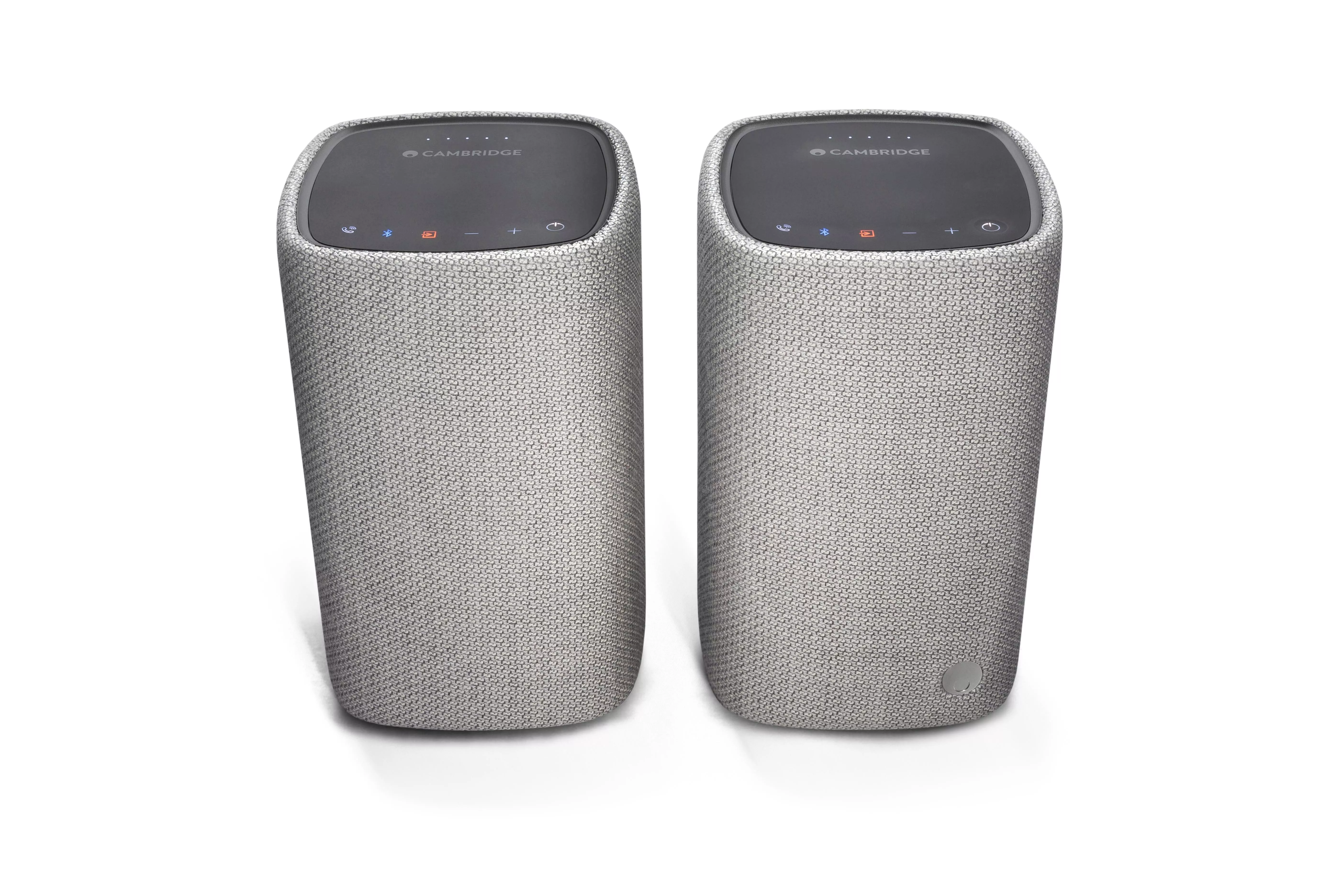 Pair of Cambridge Audio wireless Bluetooth speakers in grey fabric finish with top touch controls, front view