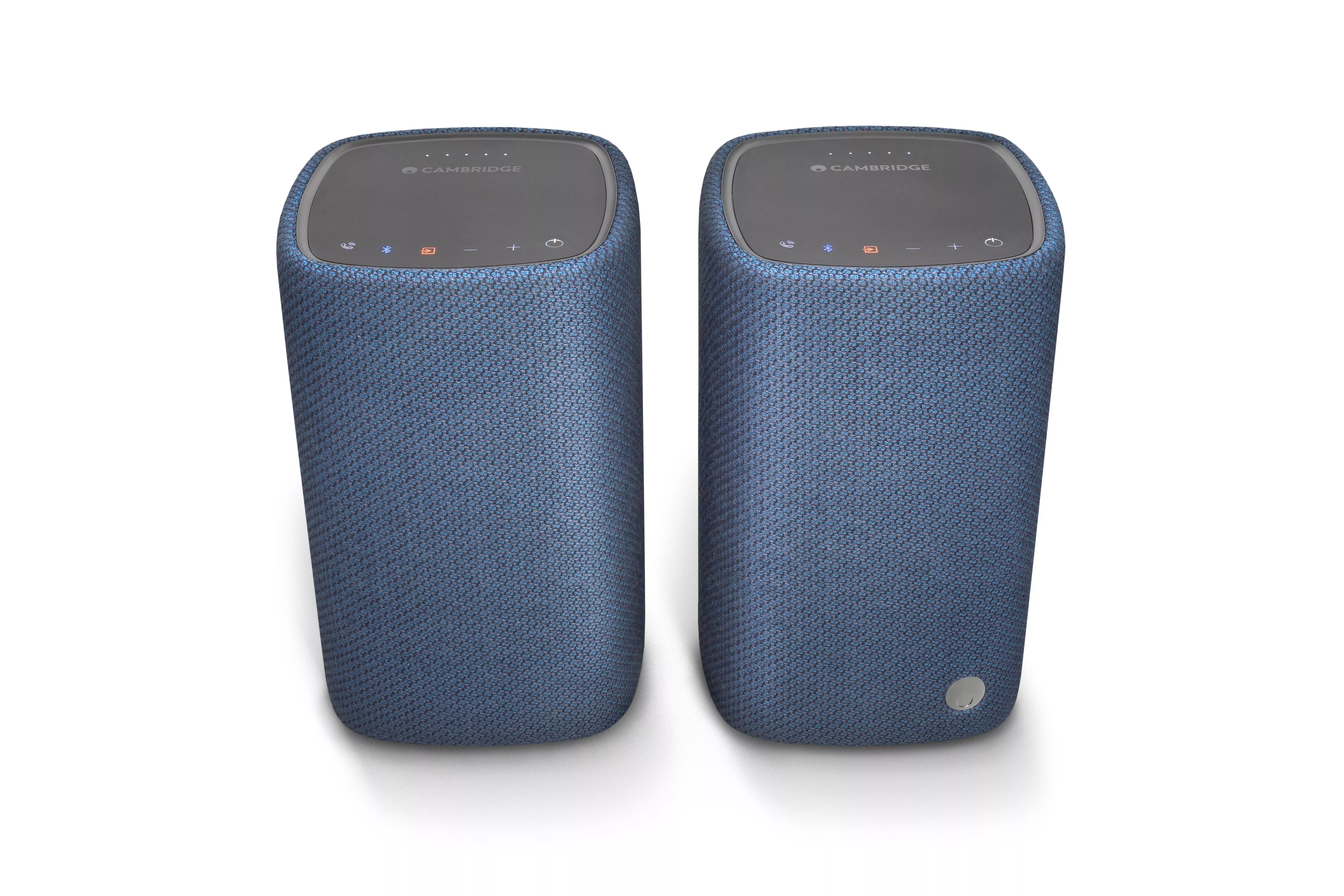 Pair of Cambridge Audio blue fabric wireless Bluetooth speakers with touch controls, front view on white background