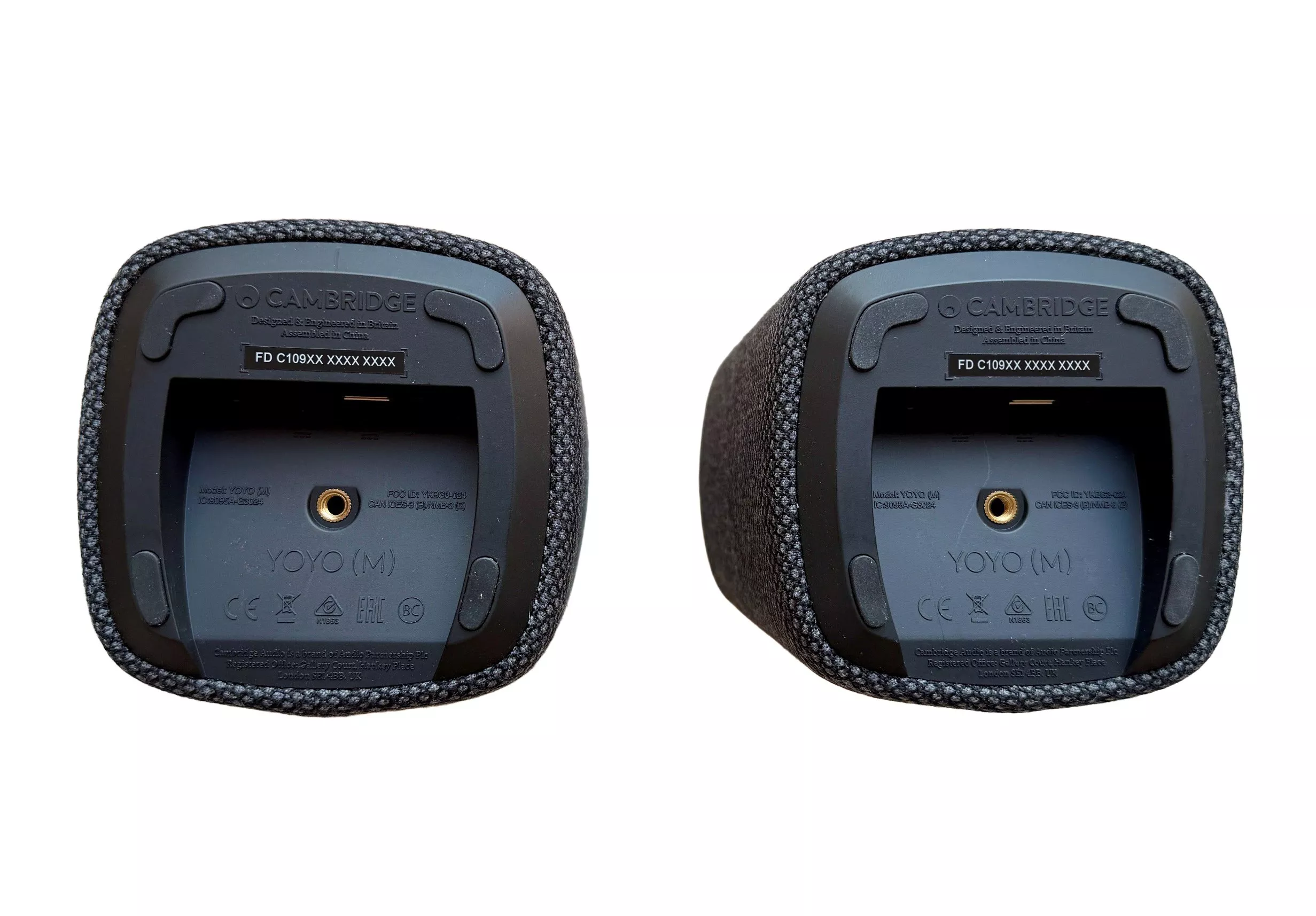 Bottom view of Cambridge Audio YoYo (M) portable Bluetooth speakers, showing base label and mounting thread.