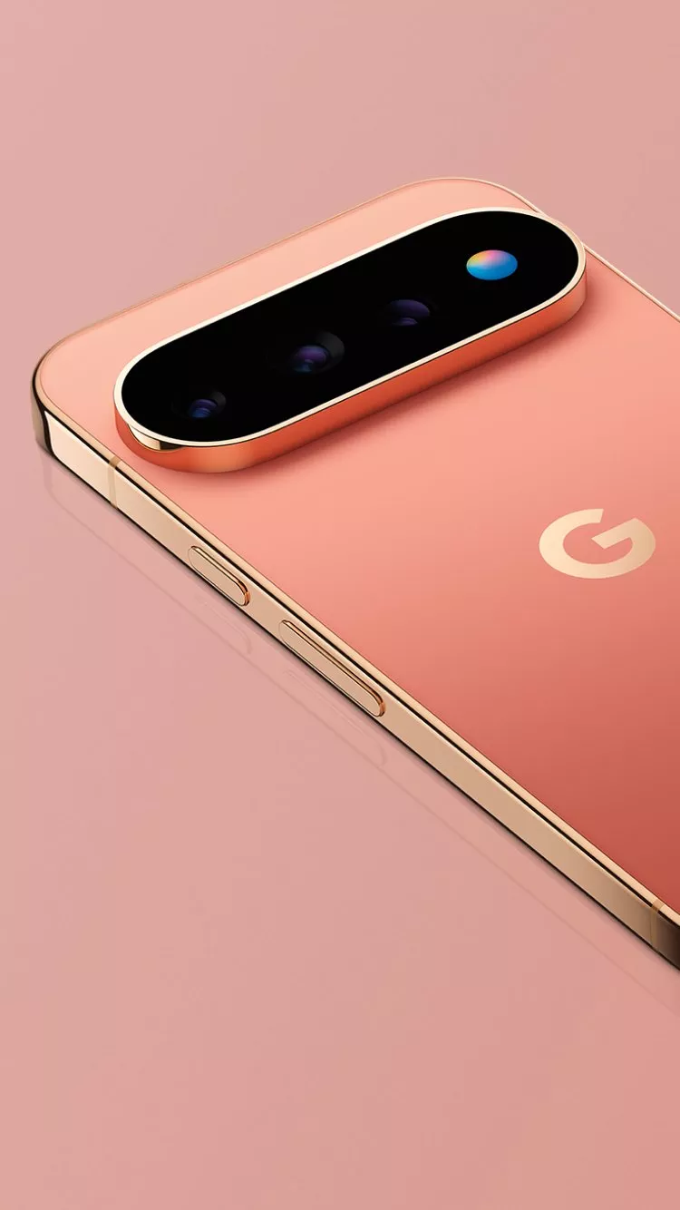 Close-up of a rose gold Google Pixel smartphone showing rear camera bar, lenses, and metallic frame detail
