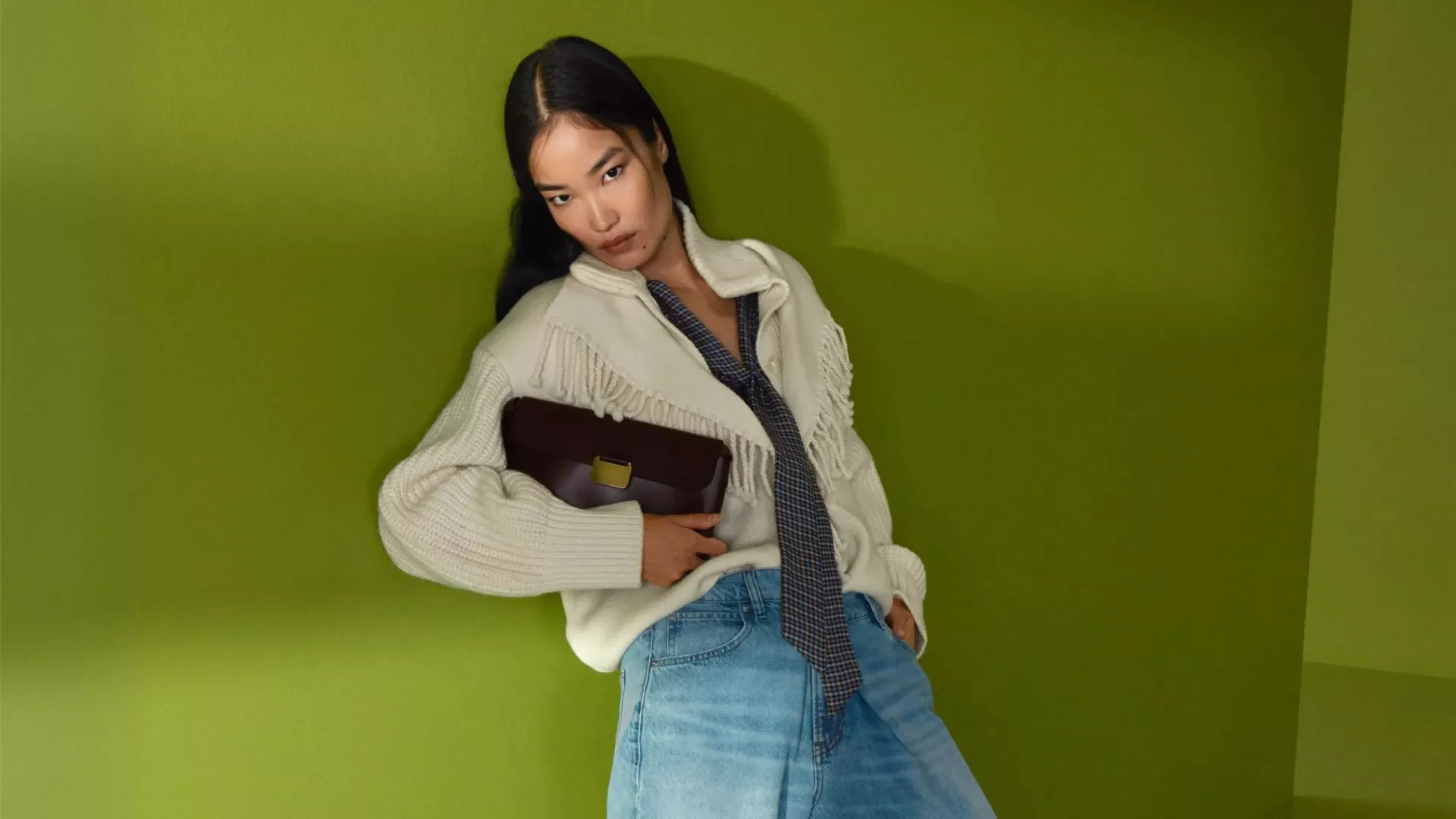 Fashion model wearing blue top and trousers