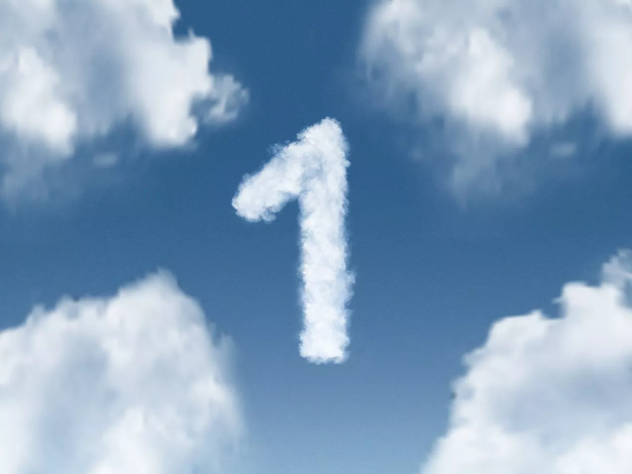 Number 1 shaped cloud in a blue sky with fluffy white clouds, symbolising first place and a new beginning