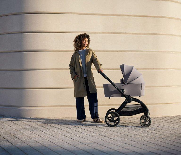 A image of a woman with a iCandy pram.