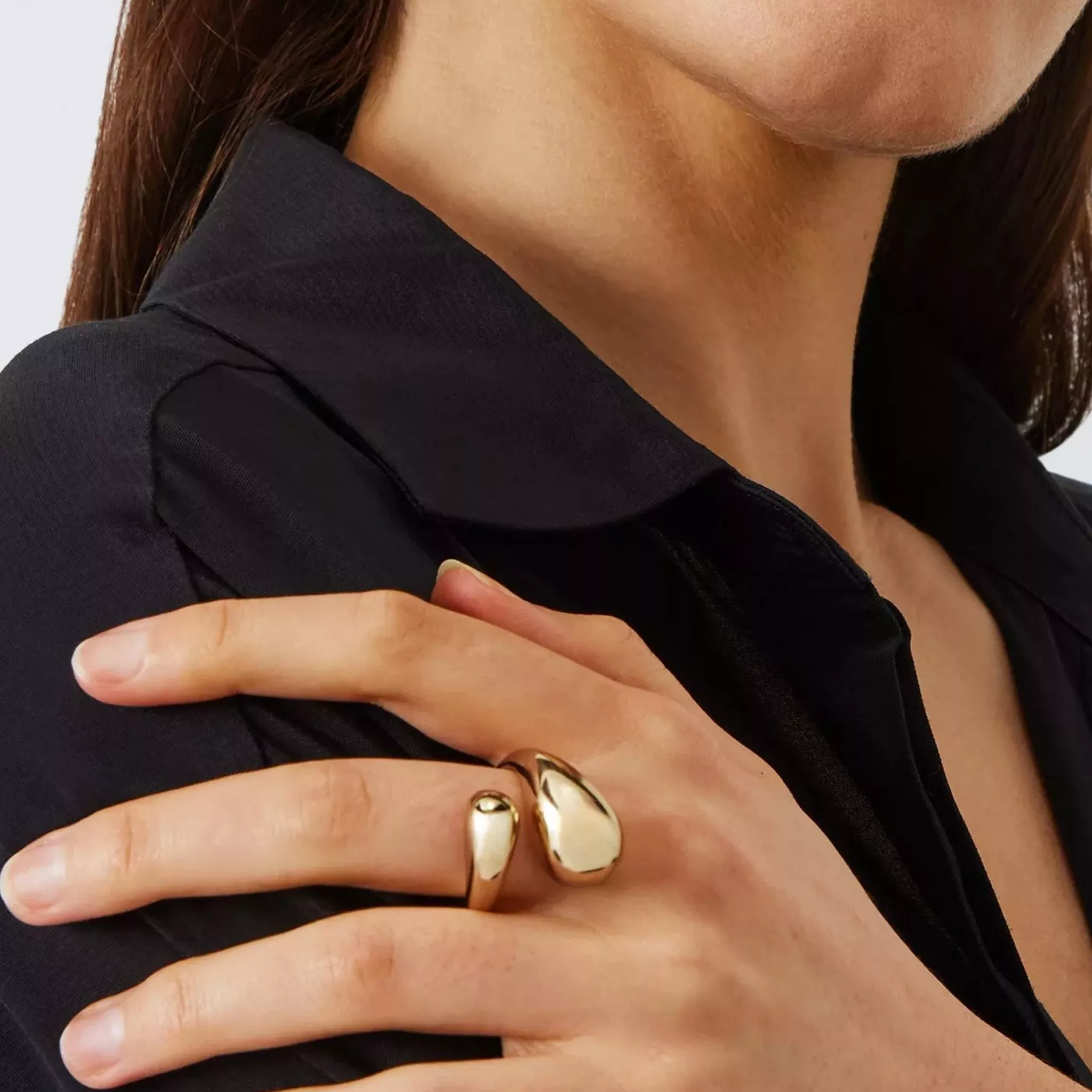 woman wearing gold chunky ring