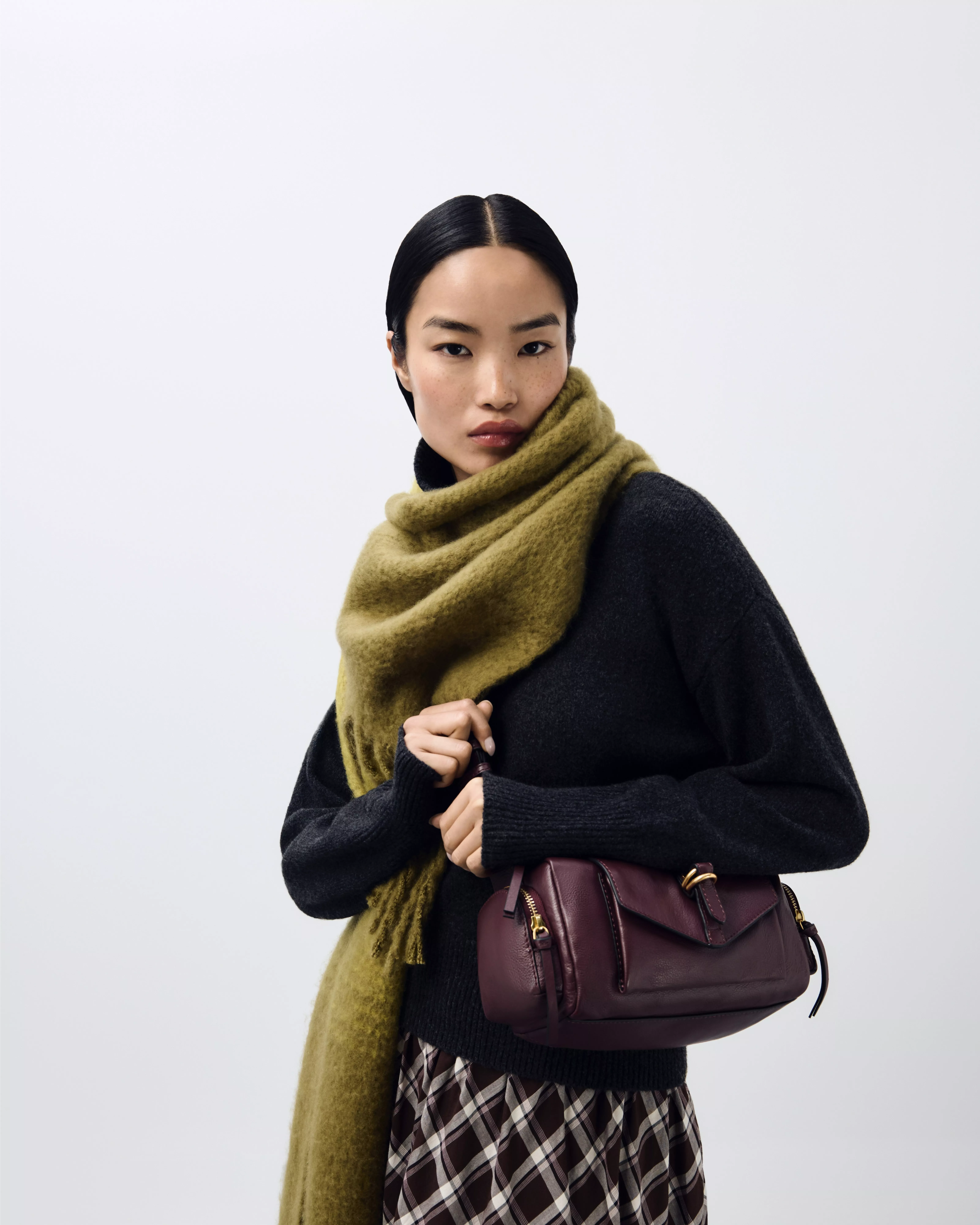 woman wearing a green wool scarf