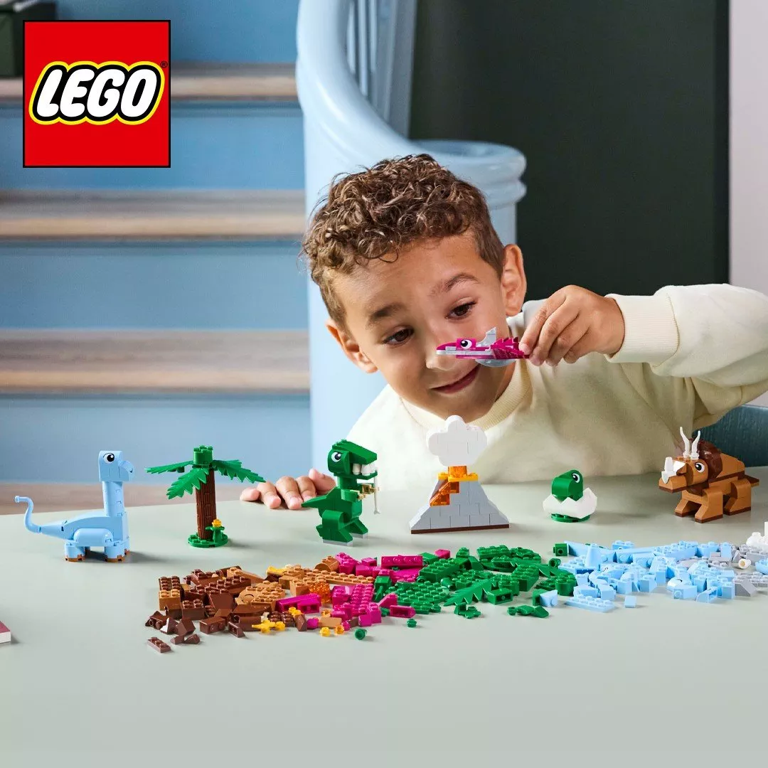 boy playing with lego figures and blocks