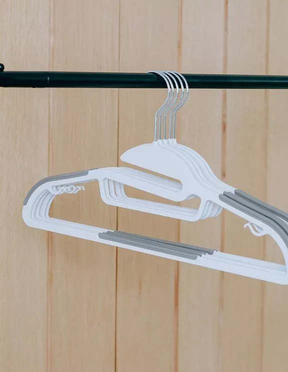 White plastic clothes hangers