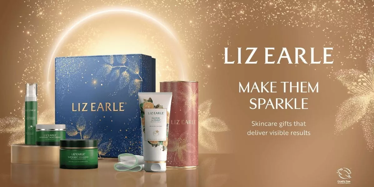 This is a Liz Earle banner showing a gift set on a gold background.