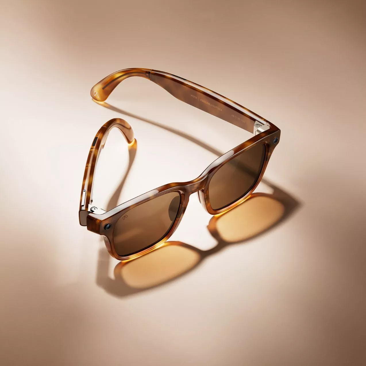 Tortoiseshell square-frame sunglasses with brown lenses on beige background, stylish eyewear product photo