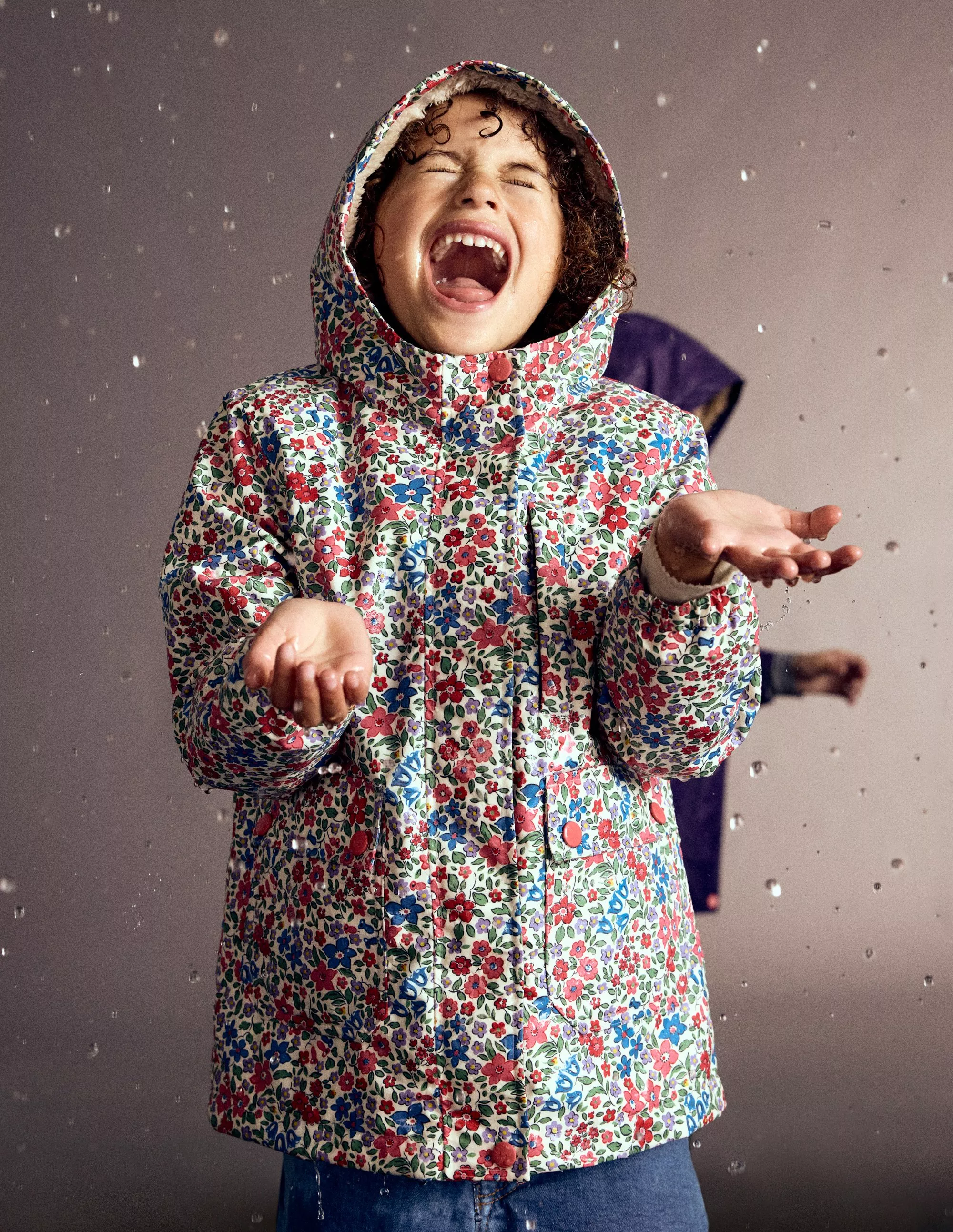 Girl in Mini Boden florak jacket