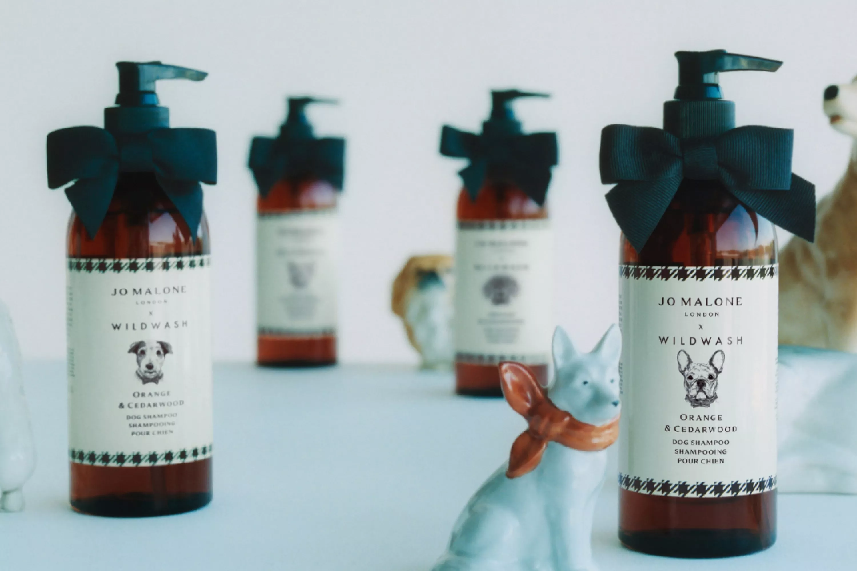 joe malone dog products on a table next to a miniature porcelain dog