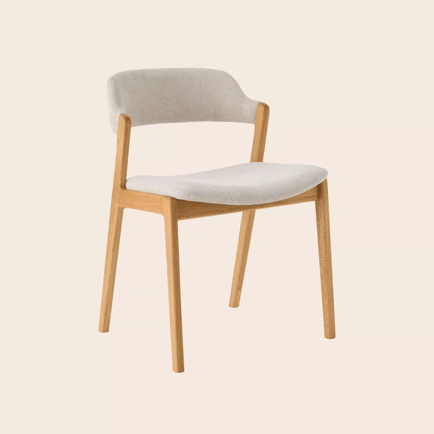 Modern upholstered dining chair with light grey fabric seat and backrest, solid oak legs, studio shot
