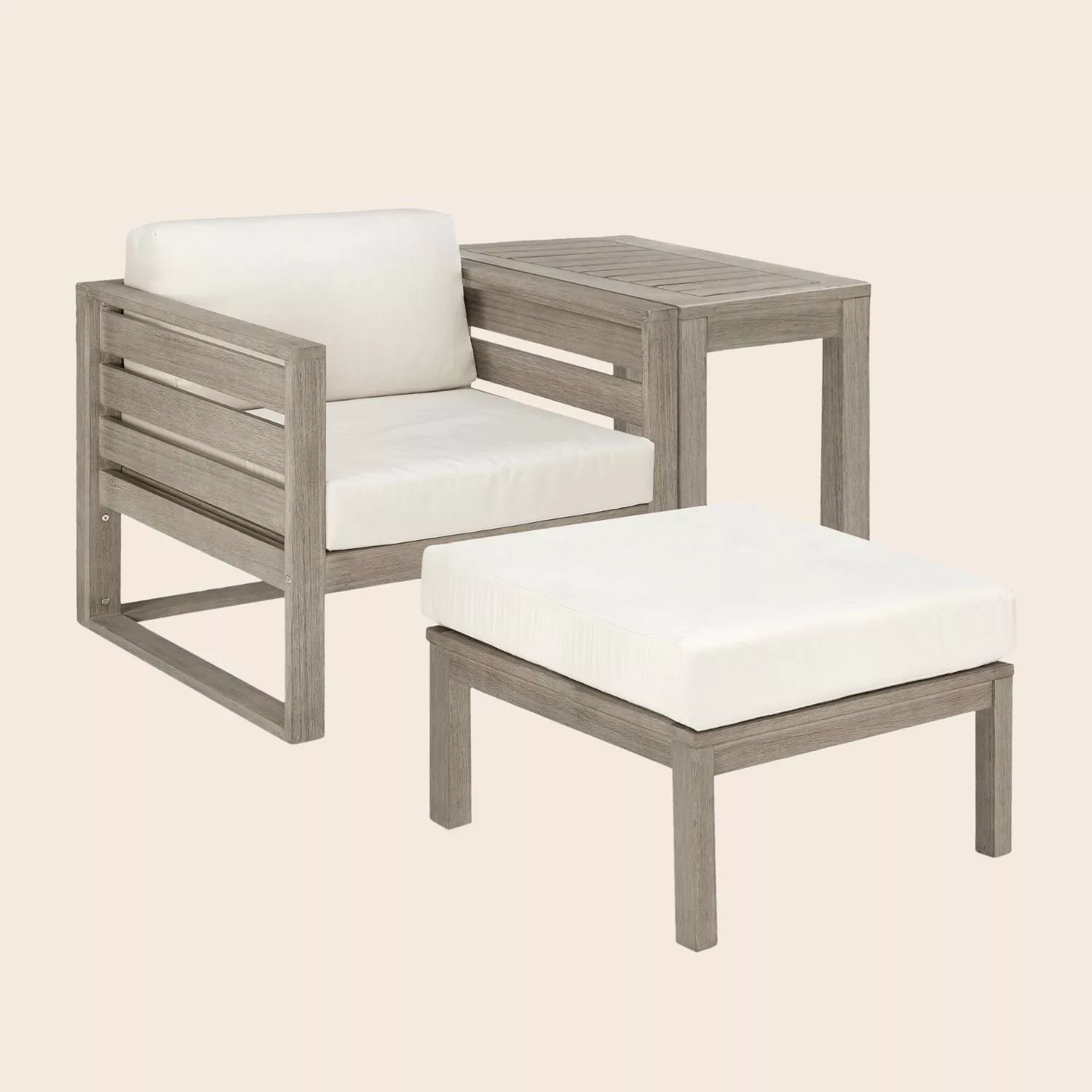 Grey wooden outdoor lounge chair with white cushions, side table and matching footstool, patio set