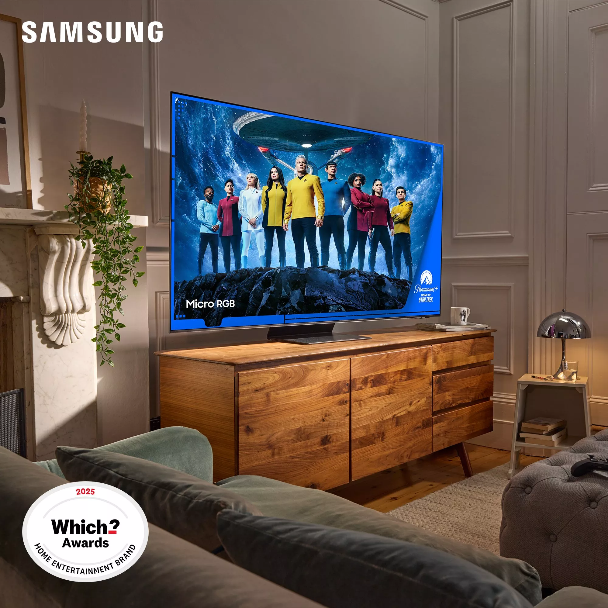 A large Samsung Micro RGB TV on a wooden console in a modern living room, displaying Star Trek: Strange New Worlds from Paramount+.
