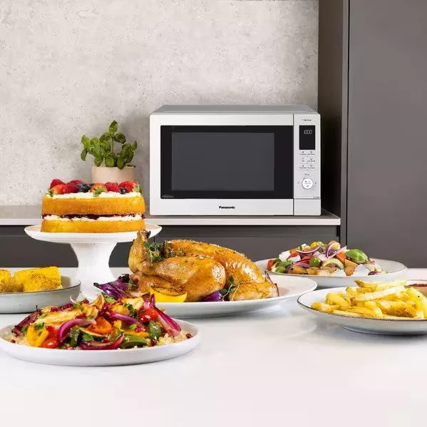 product shot of panasonic microwave with food infront of it