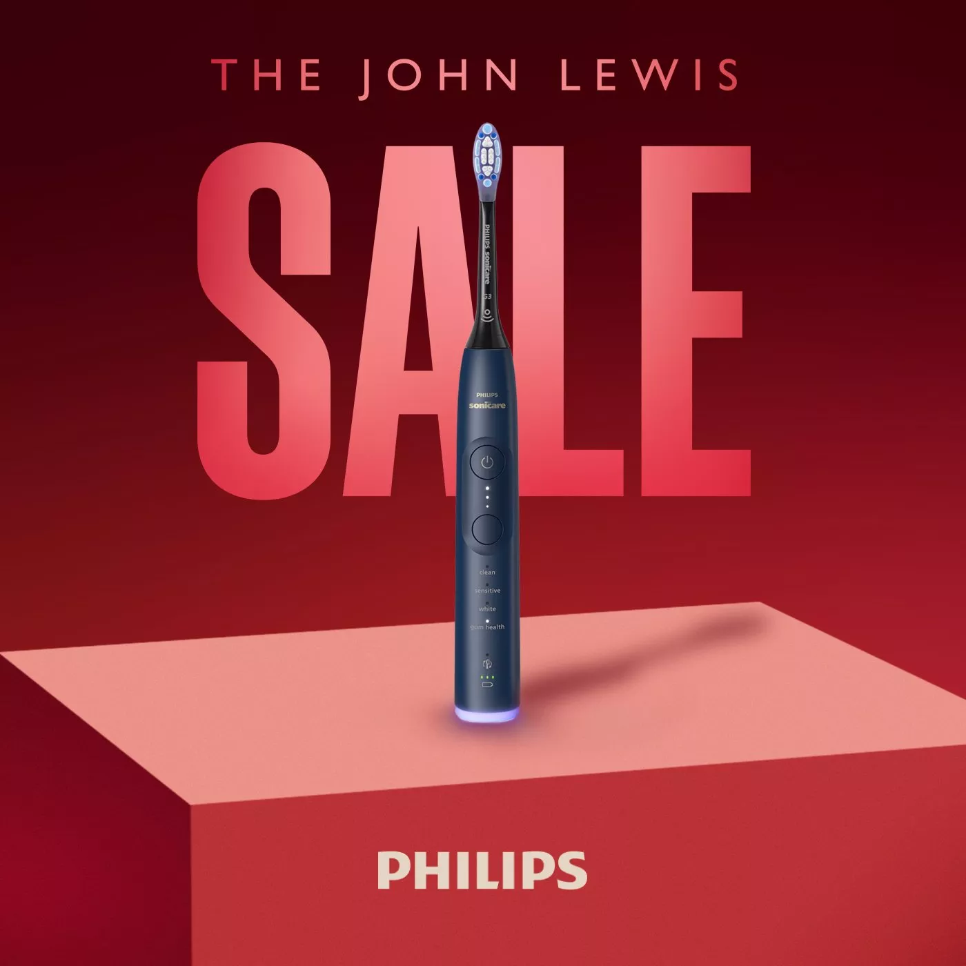 John Lewis sale banner featuring Philips Sonicare electric toothbrush on red podium with Philips logo