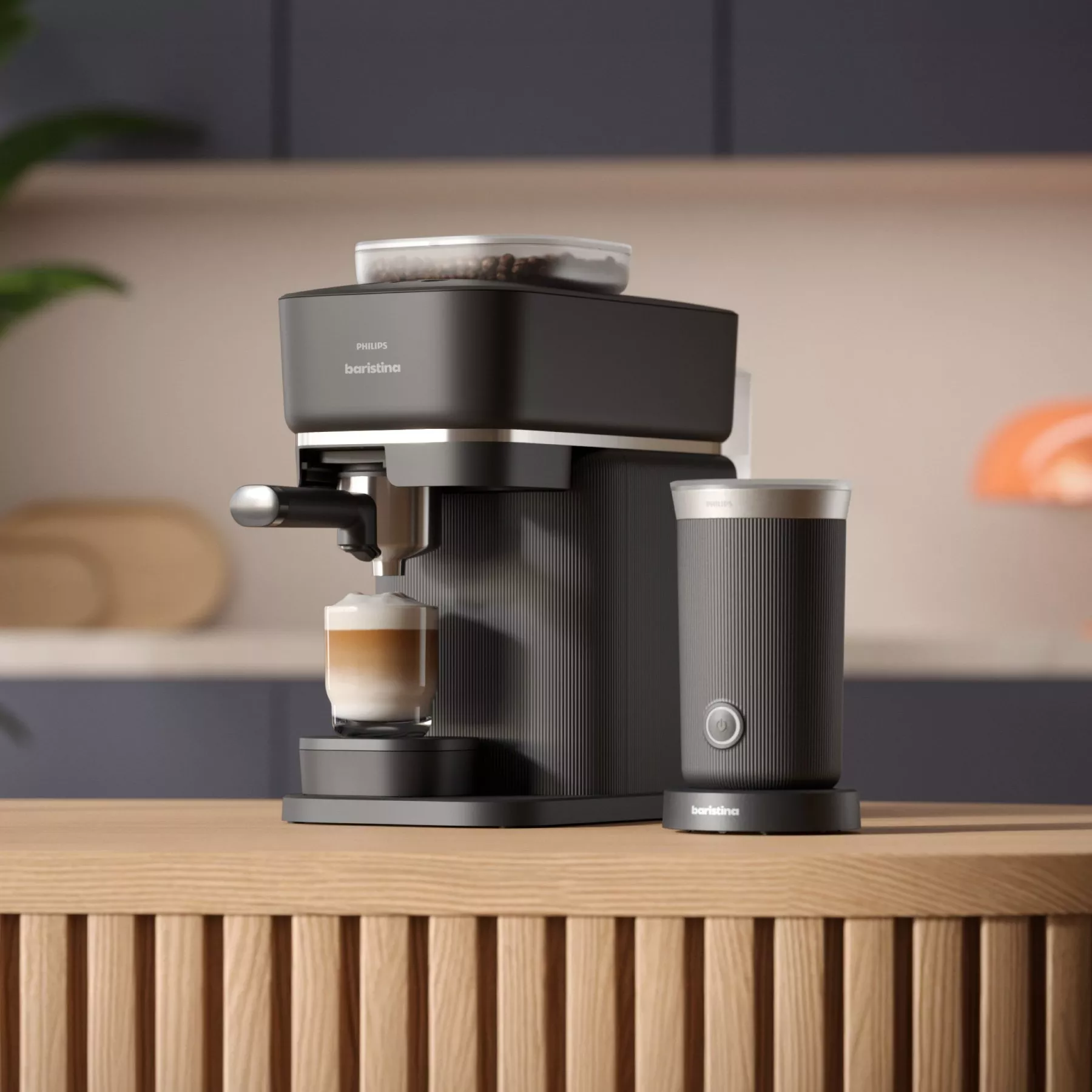 Modern espresso machine in a stylish kitchen setting, brewing coffee with a milk frother beside it on a wooden counter.