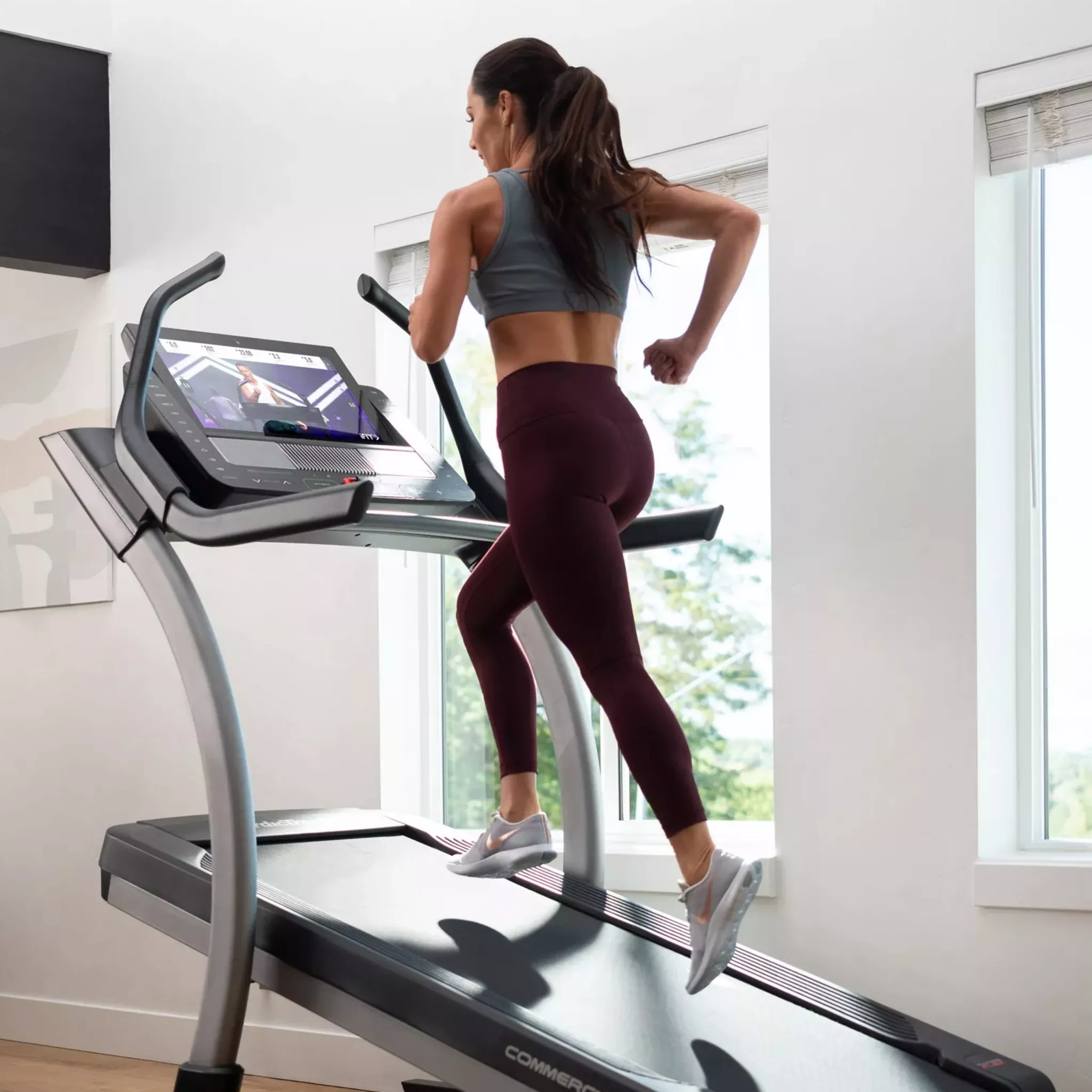 woman running on an inclined treadmill
