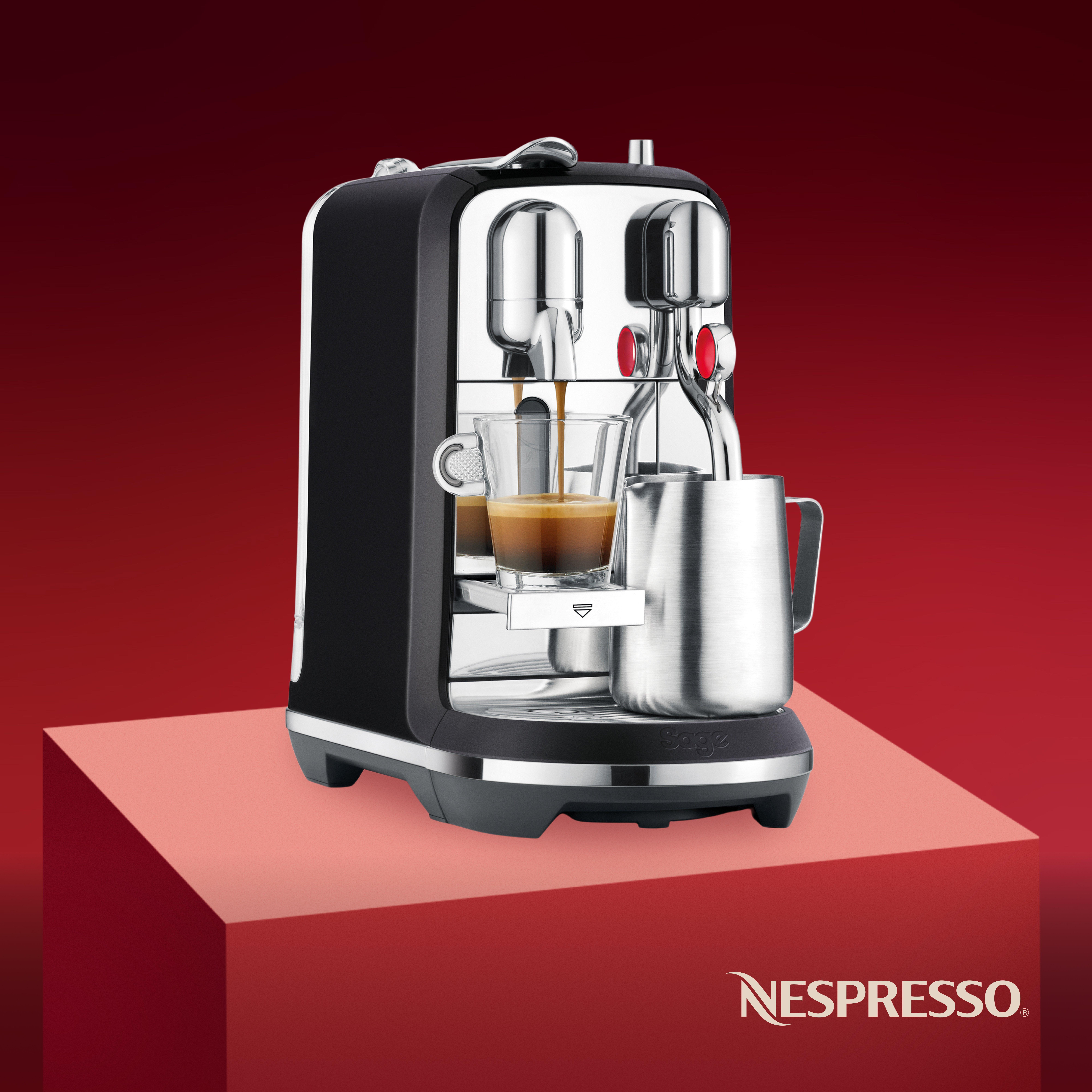 nespresso coffee machine on a red backbround and plinth