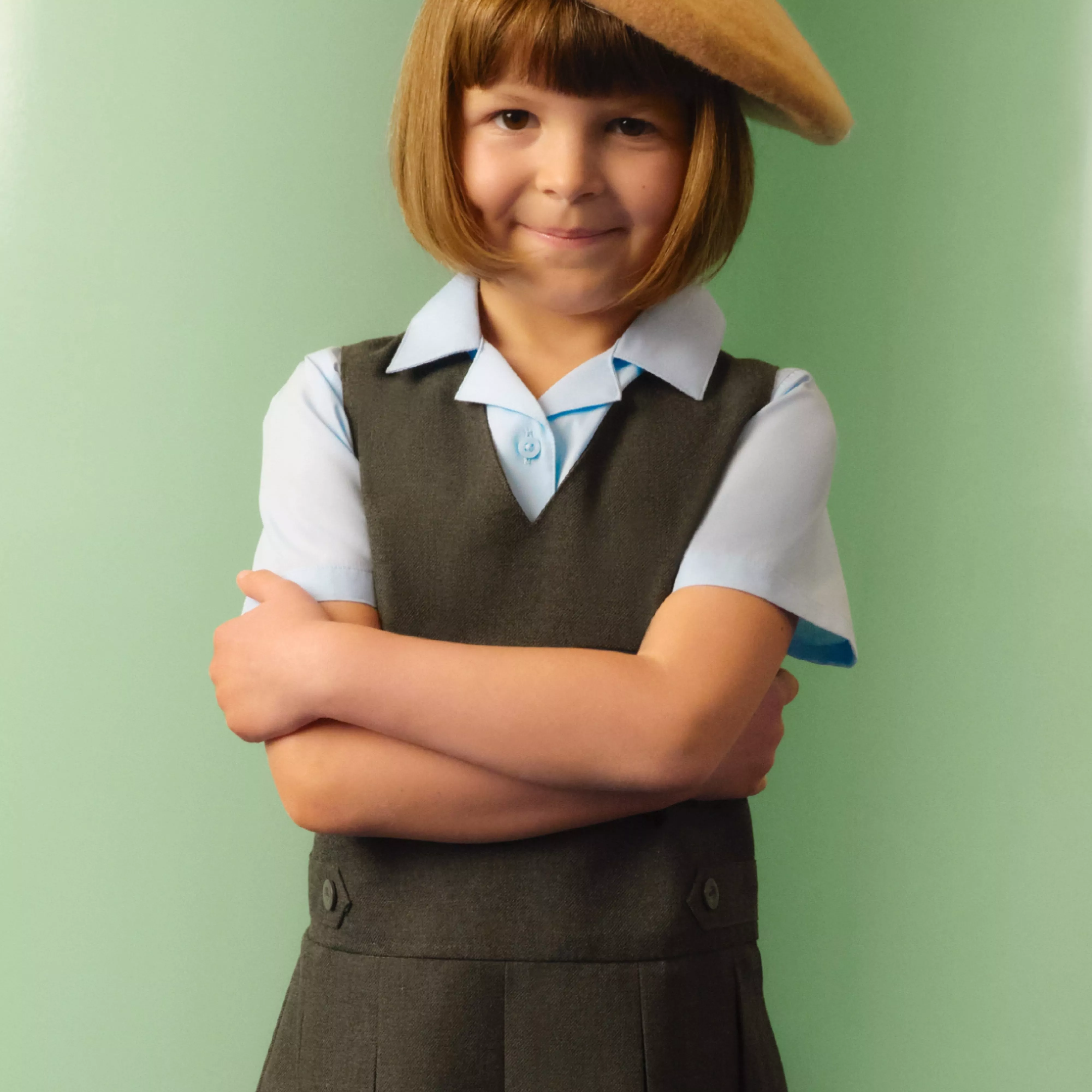girl wearing a dark grey dress and a light blue shirt