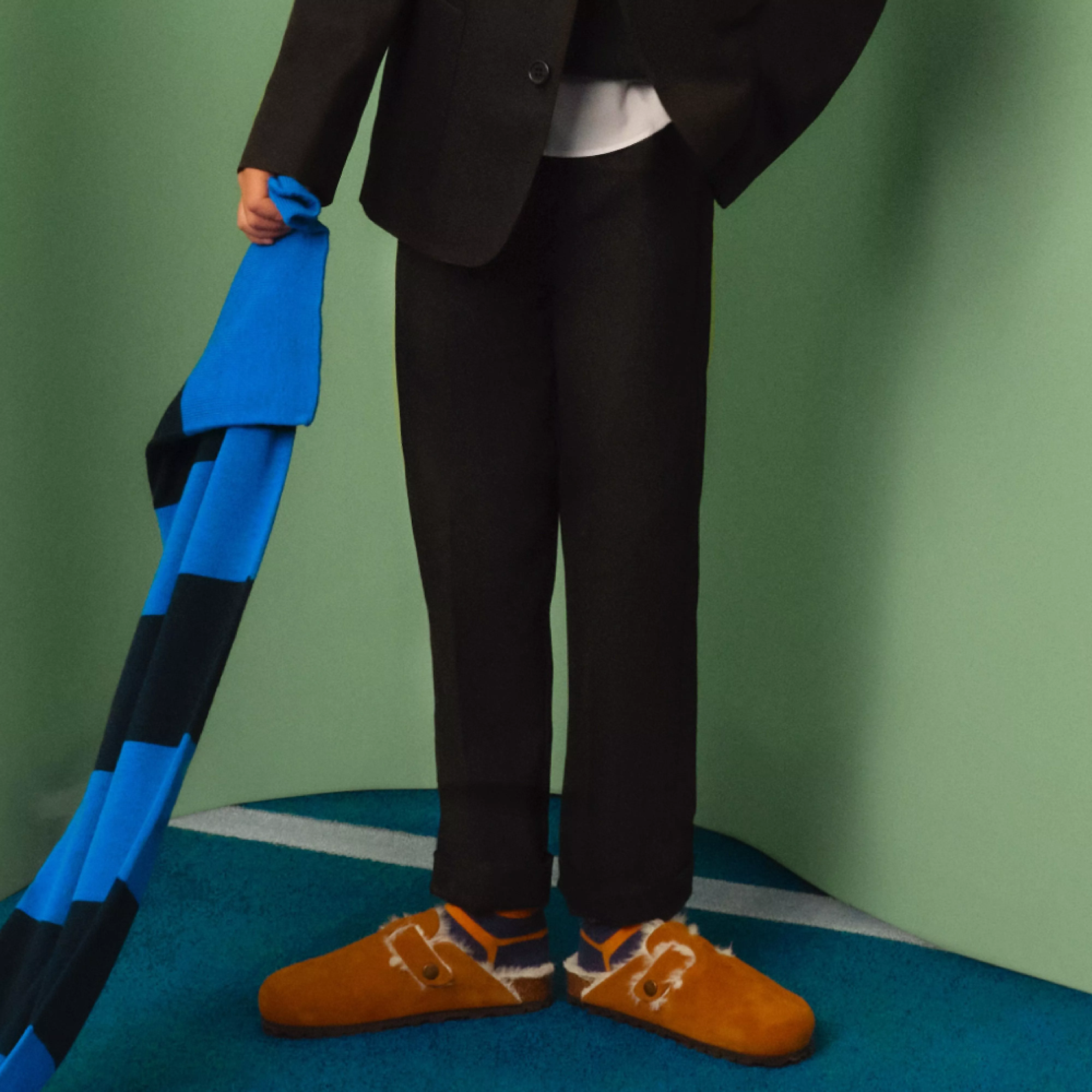 boy wearing black school trousers