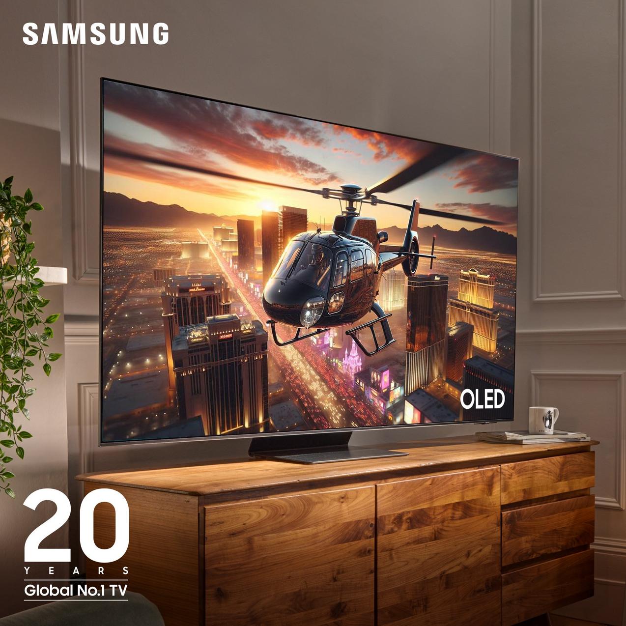 Samsung OLED TV in living room showing helicopter cityscape at sunset, celebrating 20 years Global No.1 TV