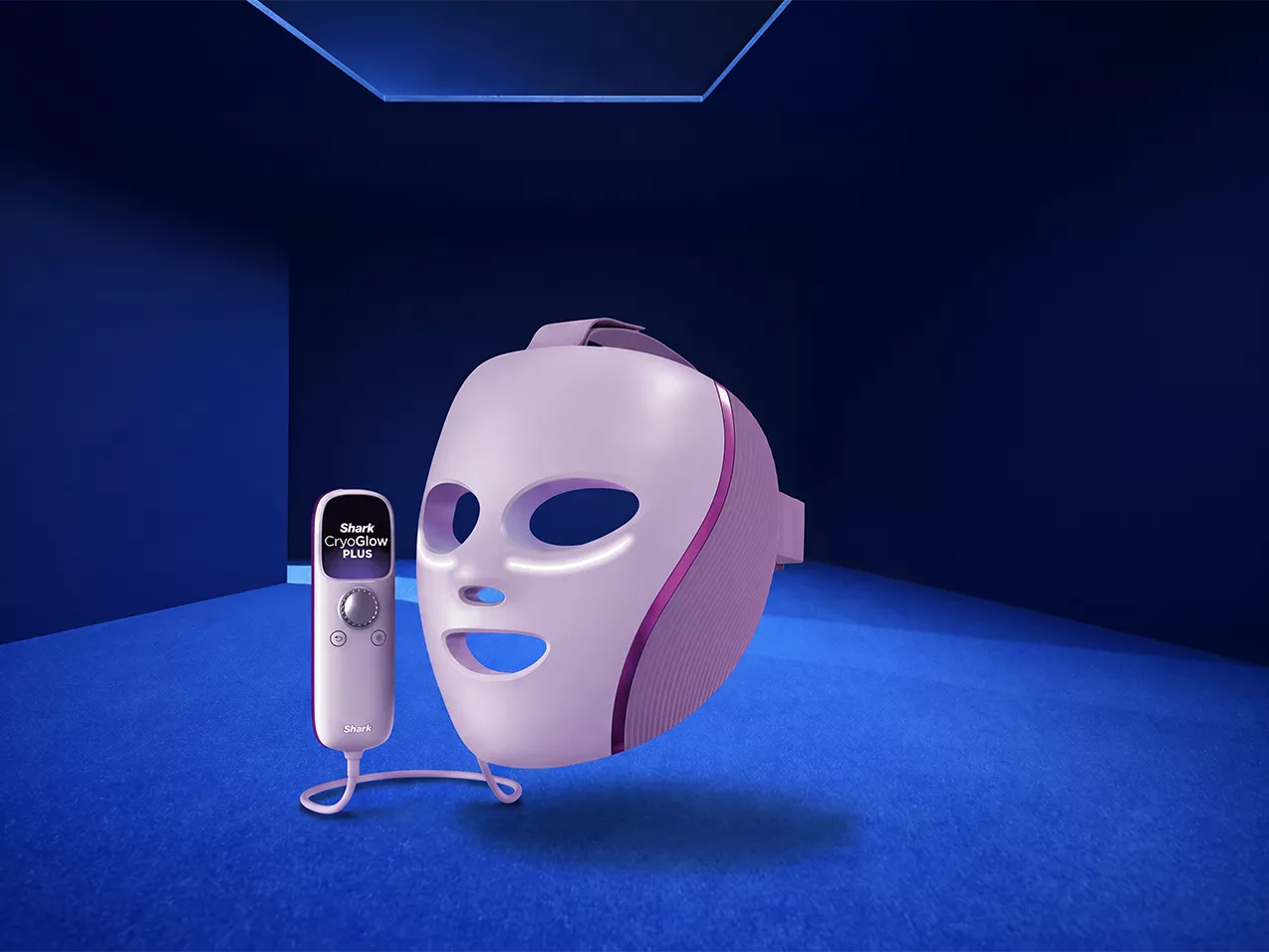 Shark CryoGlow Plus LED face mask and controller shown on blue studio set for at-home skincare treatment