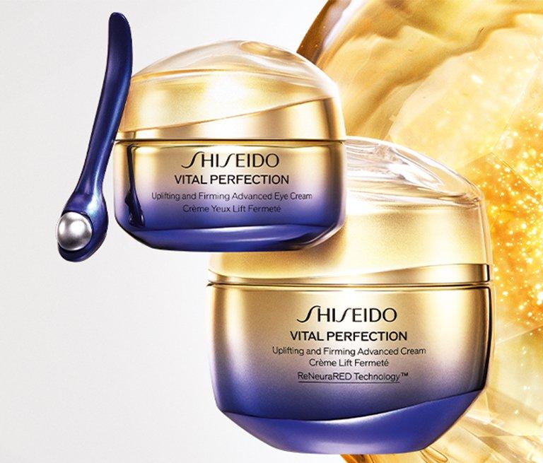 This is Shiseido banner with two eye cream products and a flower in the background