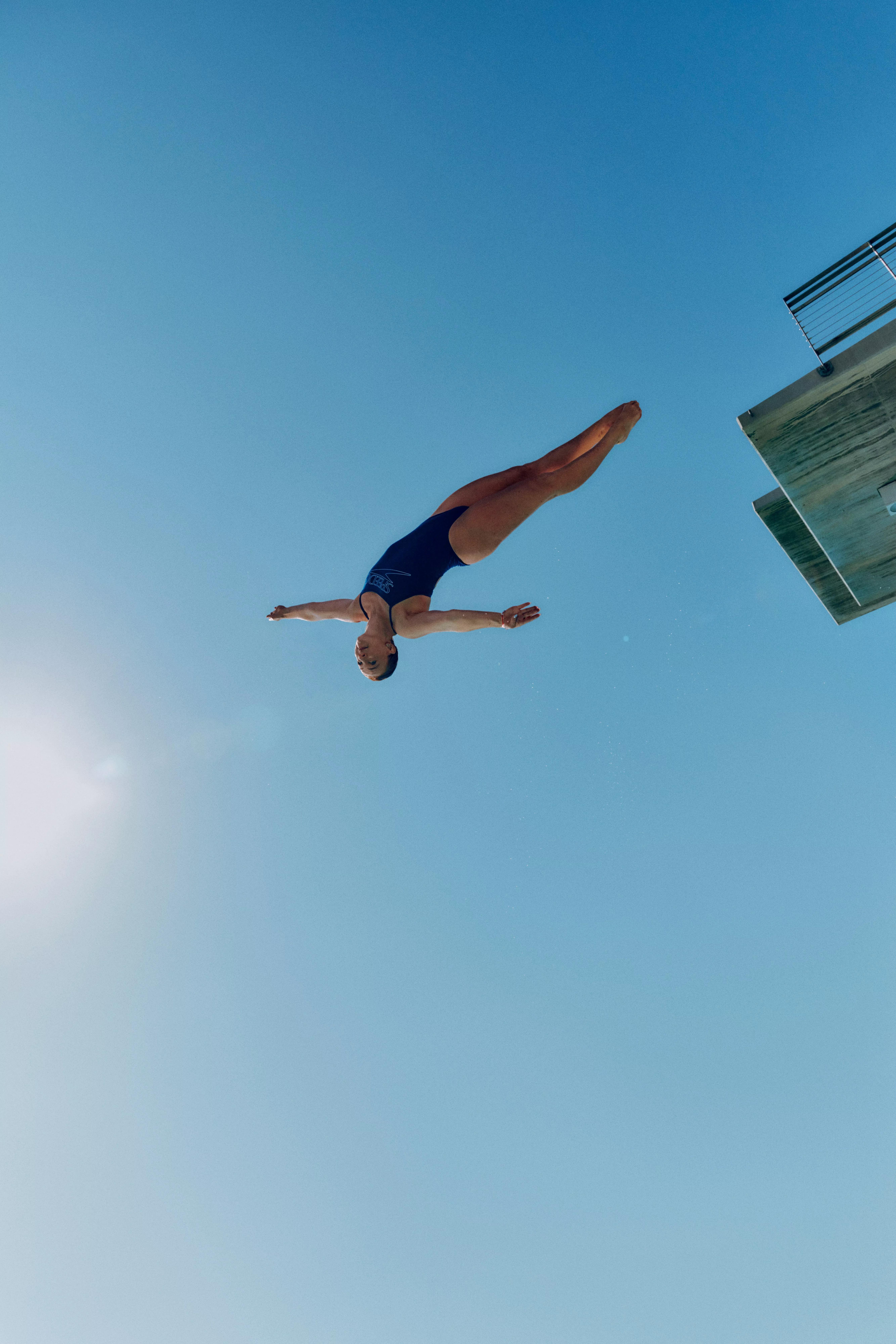 woman diving off diving board