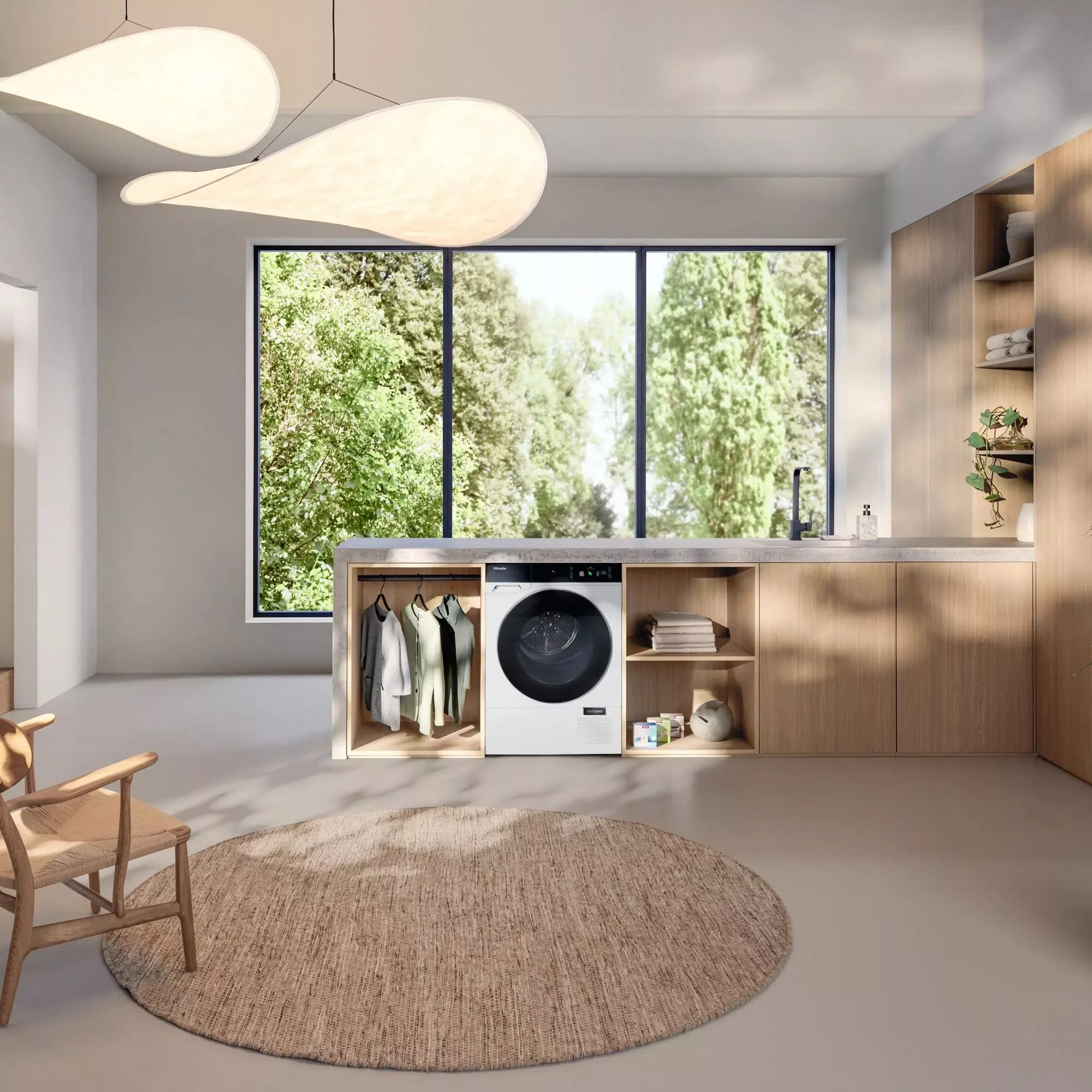 Modern laundry room with a front-load washing machine, wooden cabinetry, large window view, and stylish lighting.