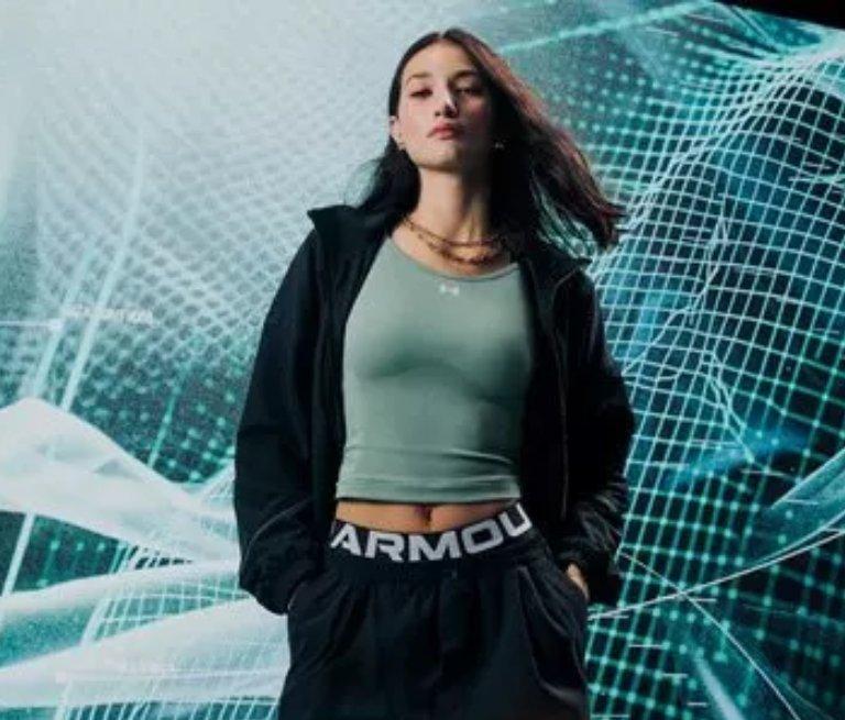 This is a brand banner with a model wearing Under Armour