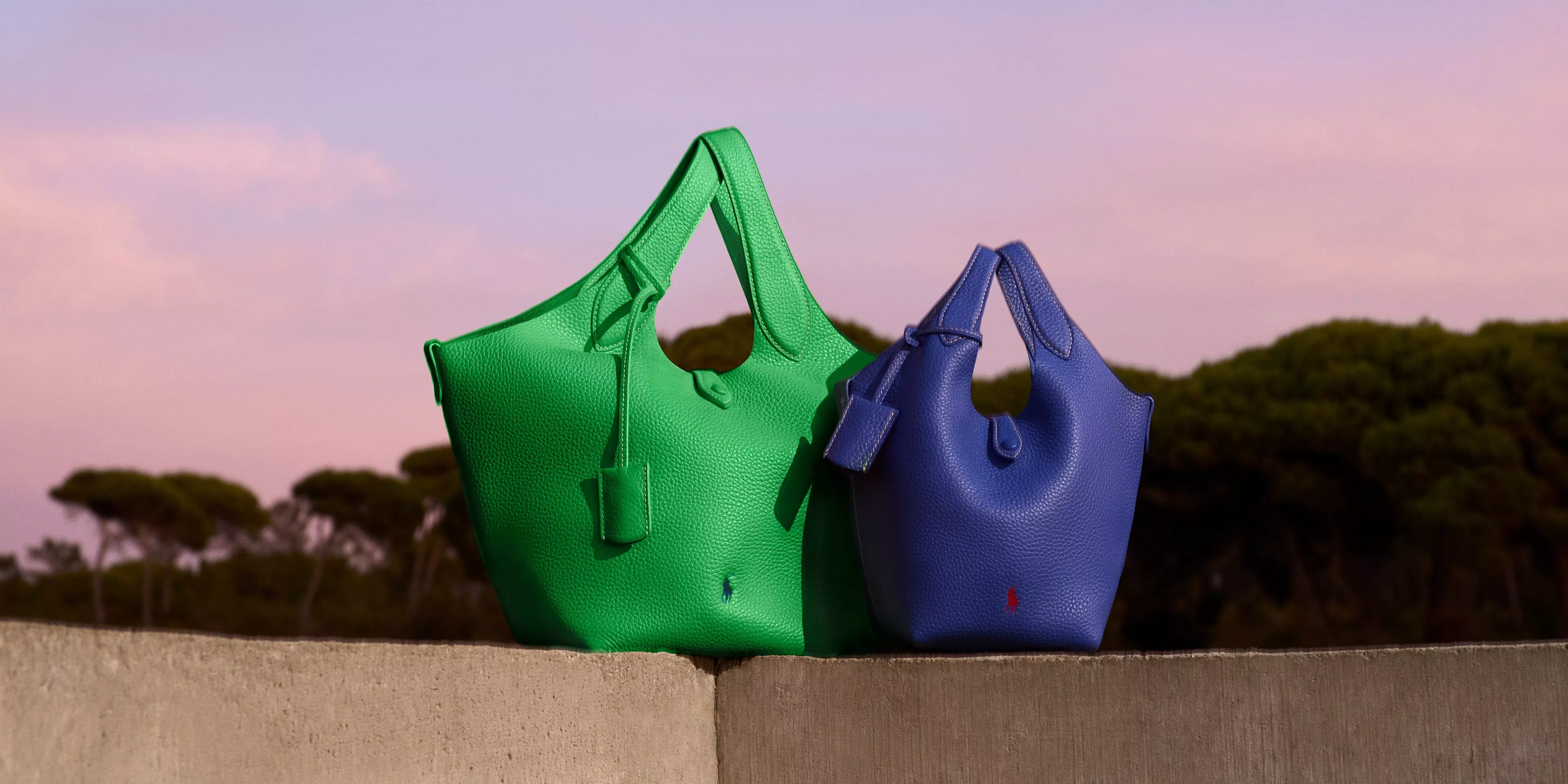 Modern bedroom with a beige headboard, rust-coloured quilt, and vibrant cushions. Abstract art hangs above the bed.