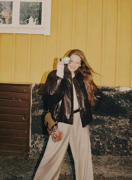 lady in brown leather jacket and tailored wide leg trousers