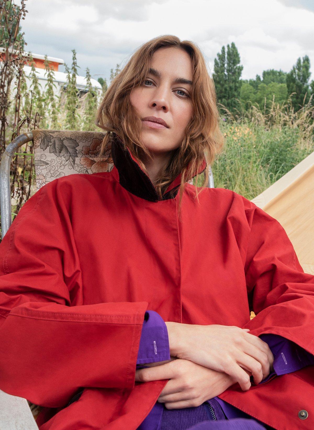 Alex Chung wearing a red Barbour jacket