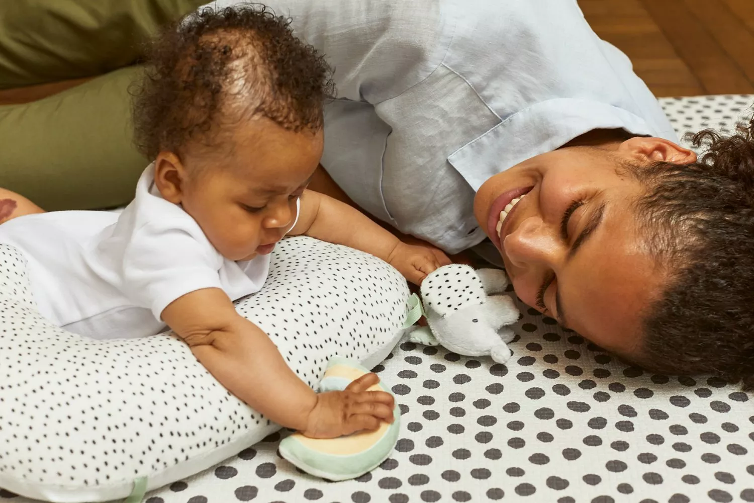 Baby lying on a playmat