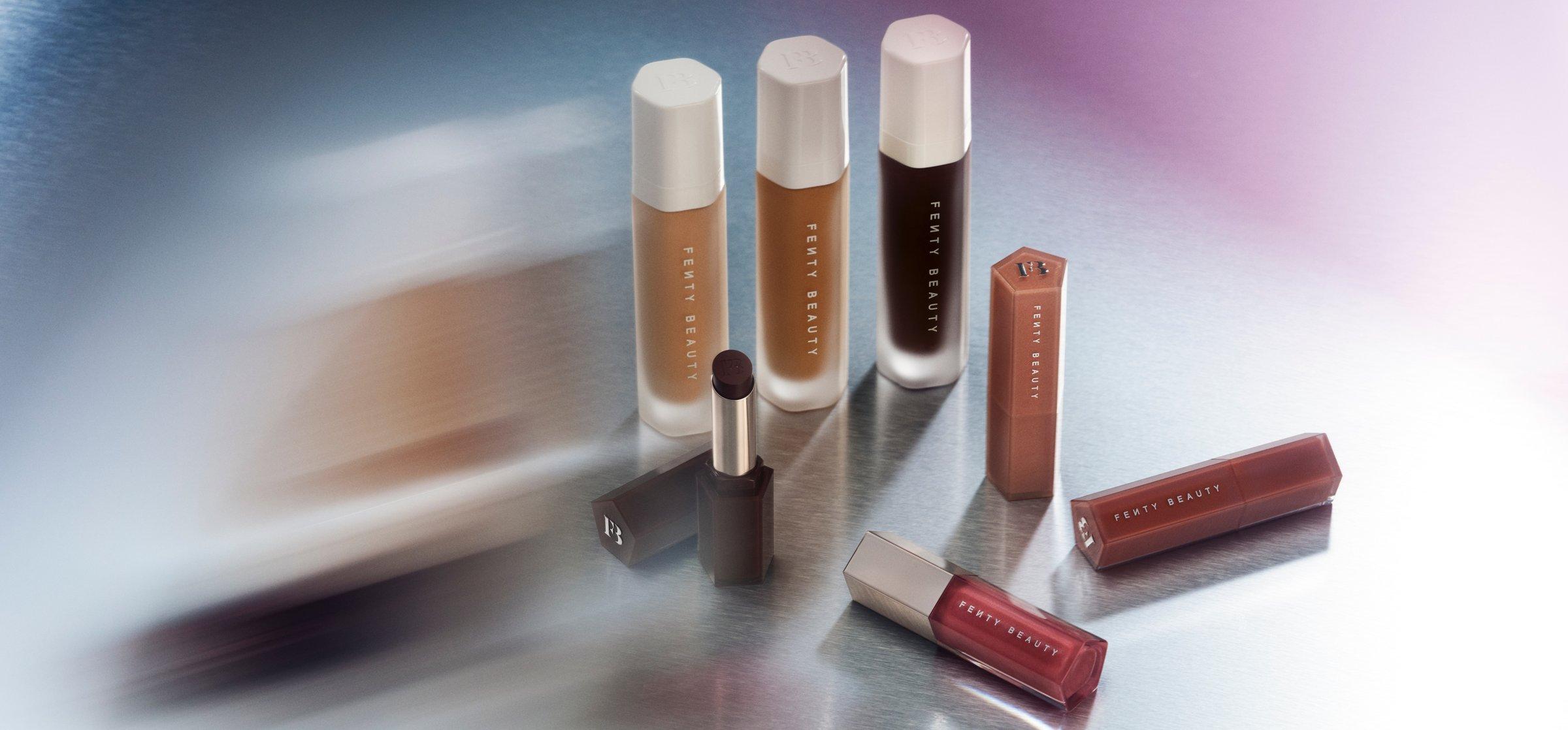 Selection of Fenty Beauty products on a silver background