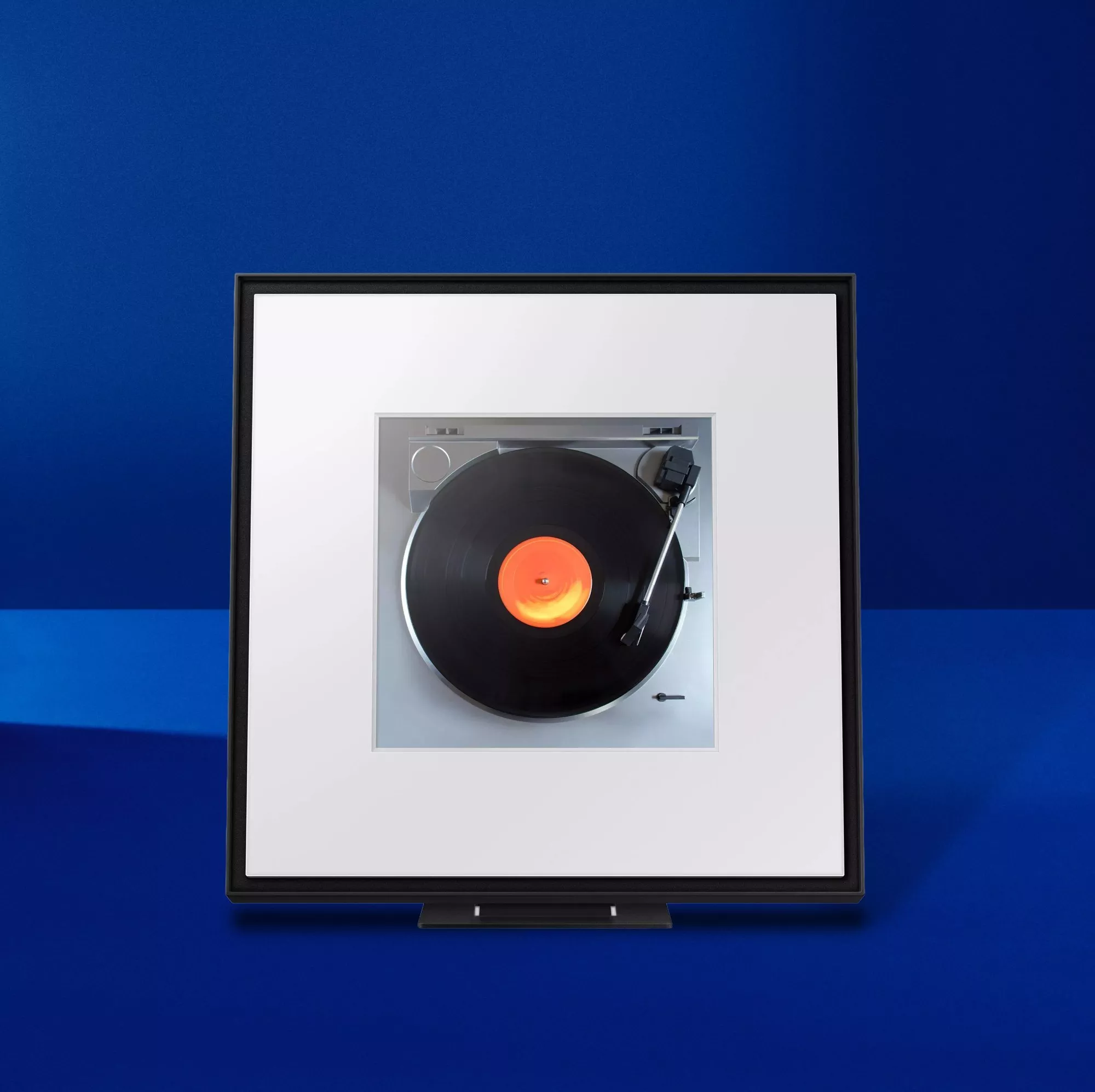 Samsung Music Frame Smart Speaker with Dolby Atmos & Alexa Built-In on a blue background