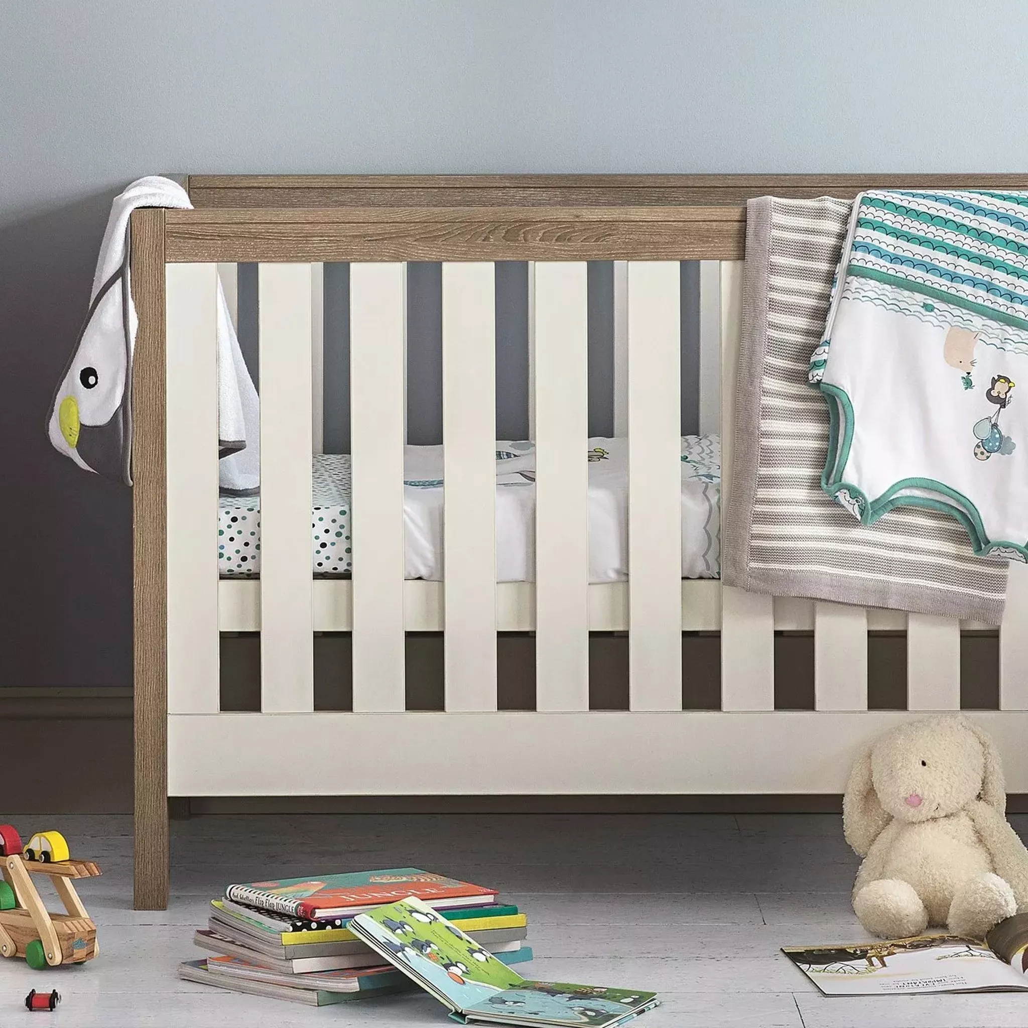 white cot in child's nursery