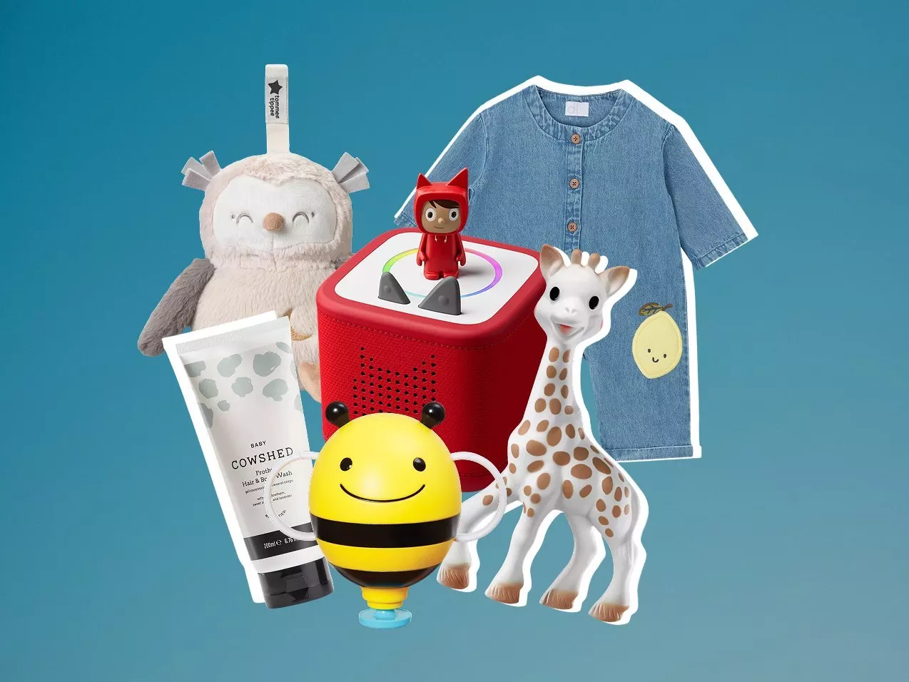 Baby gift set with denim romper, Sophie the Giraffe teether, plush toy, music box and baby wash tube on blue background