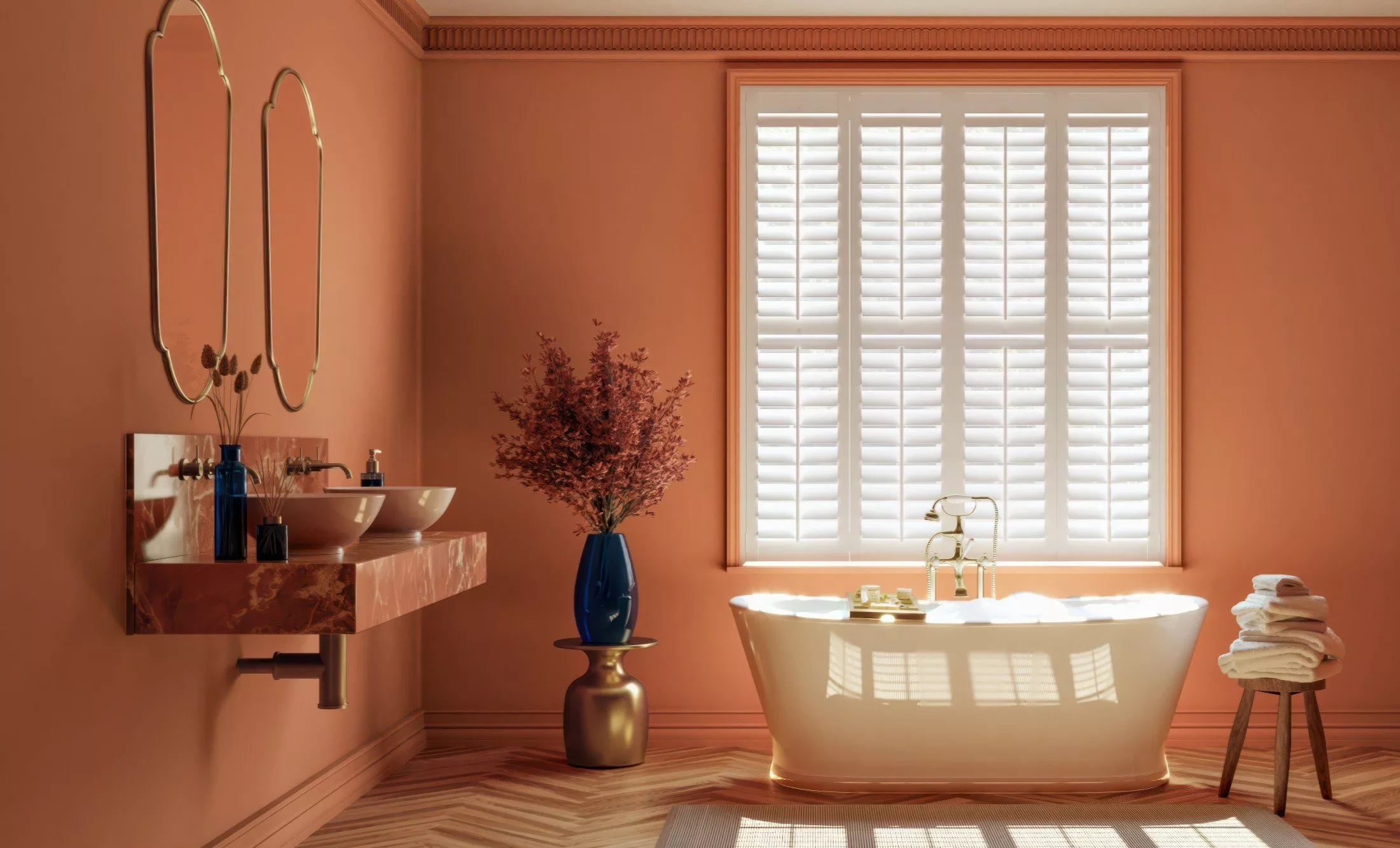 Bathroom with orange walls and white shutters on the window
