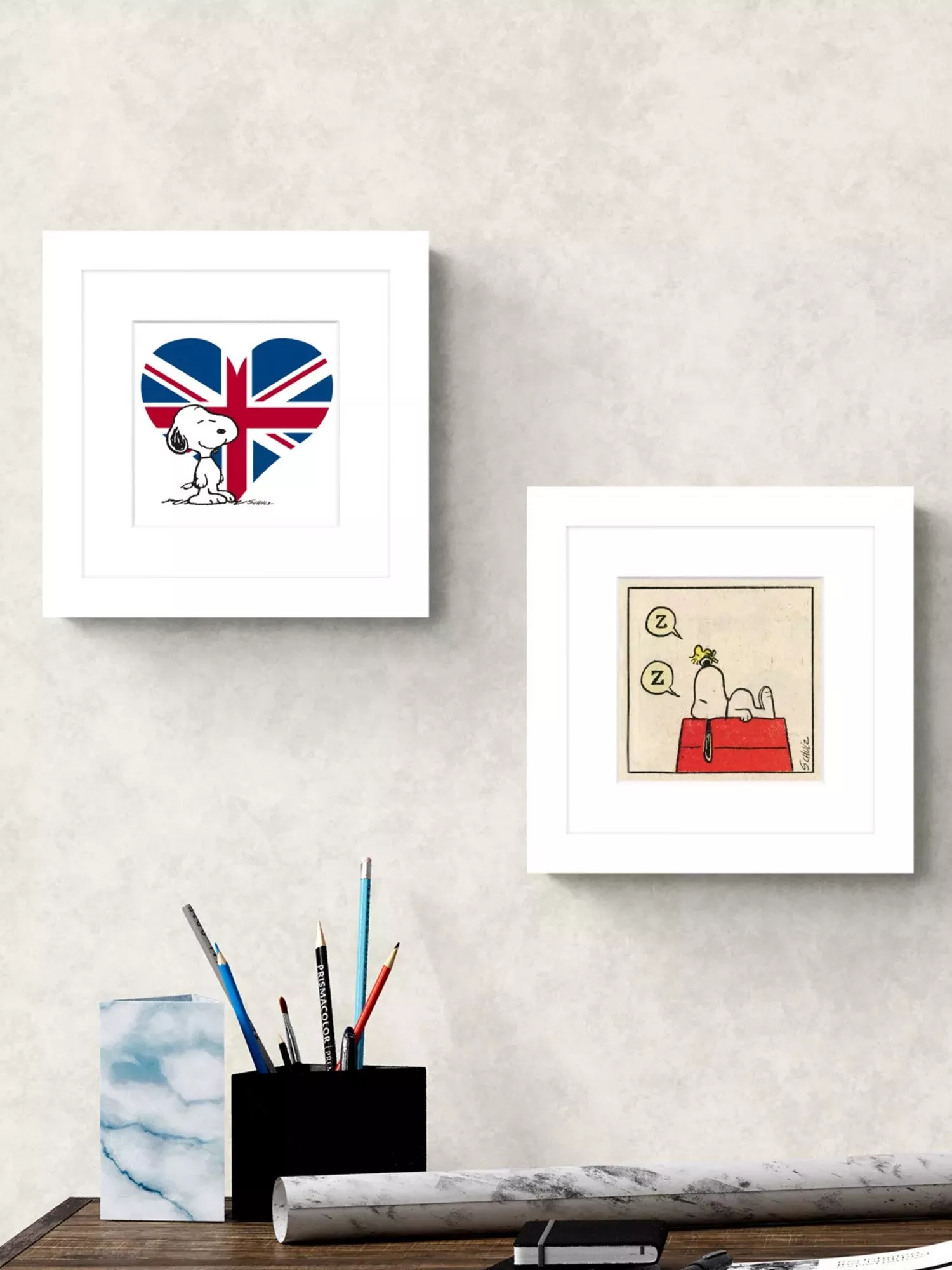 two picture frames with Snoopy art
