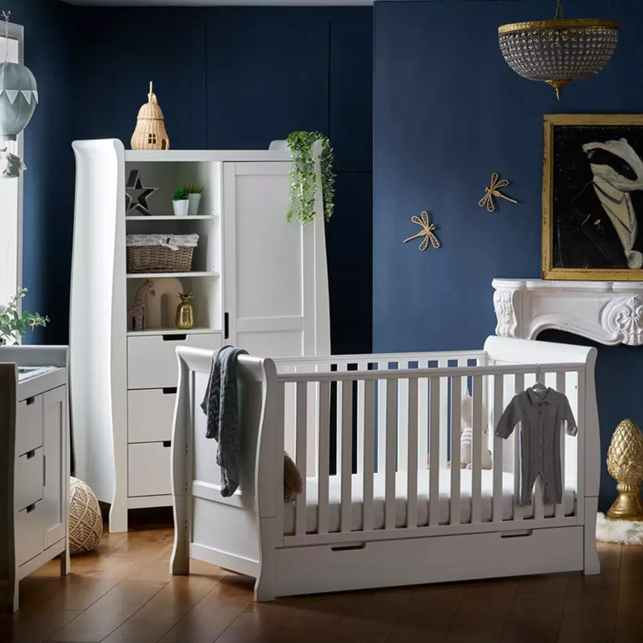 white cot and wardrobe in child's nursery