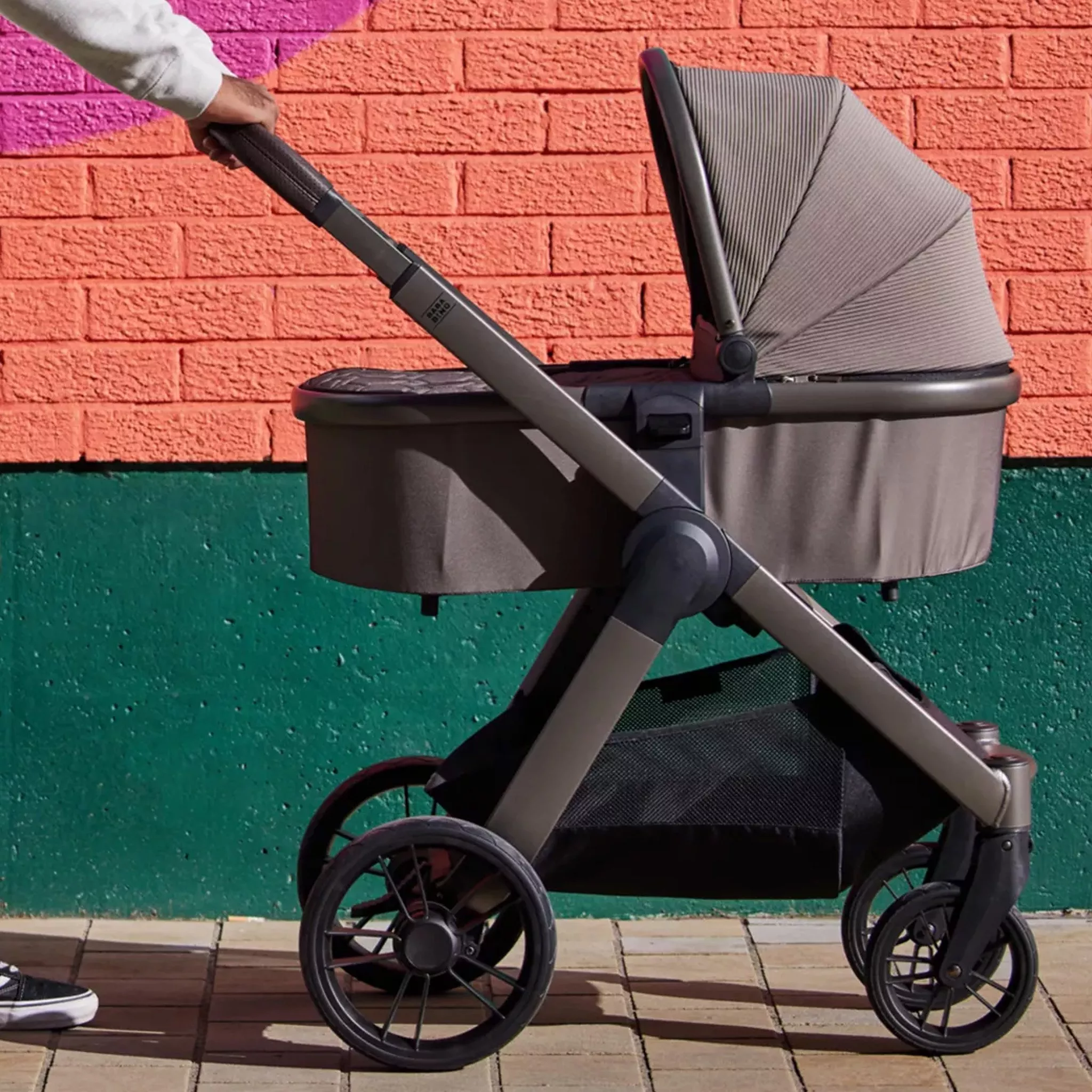 pushchair in front of a colourful background