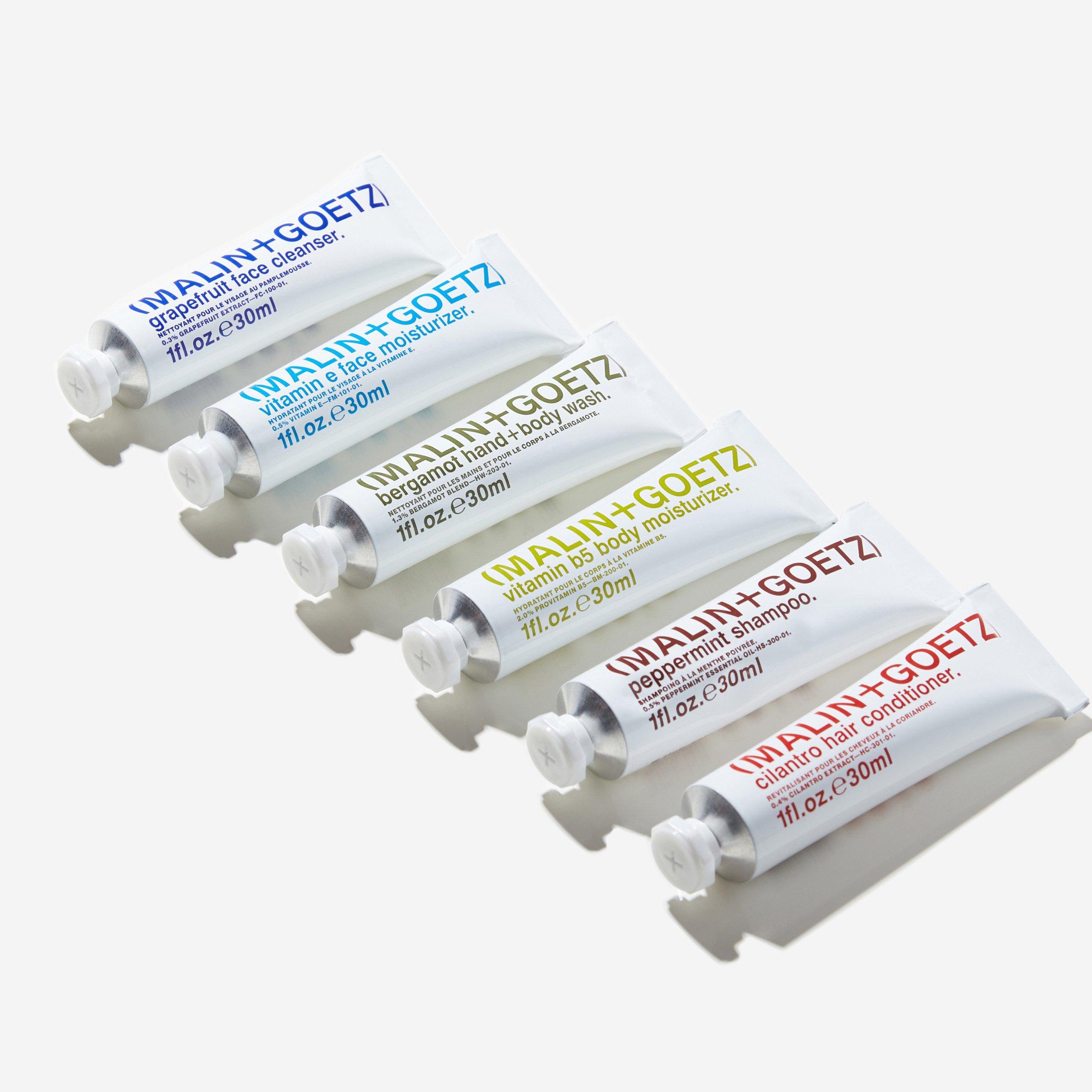 Set of six MALIN+GOETZ travel-size skincare and haircare tubes