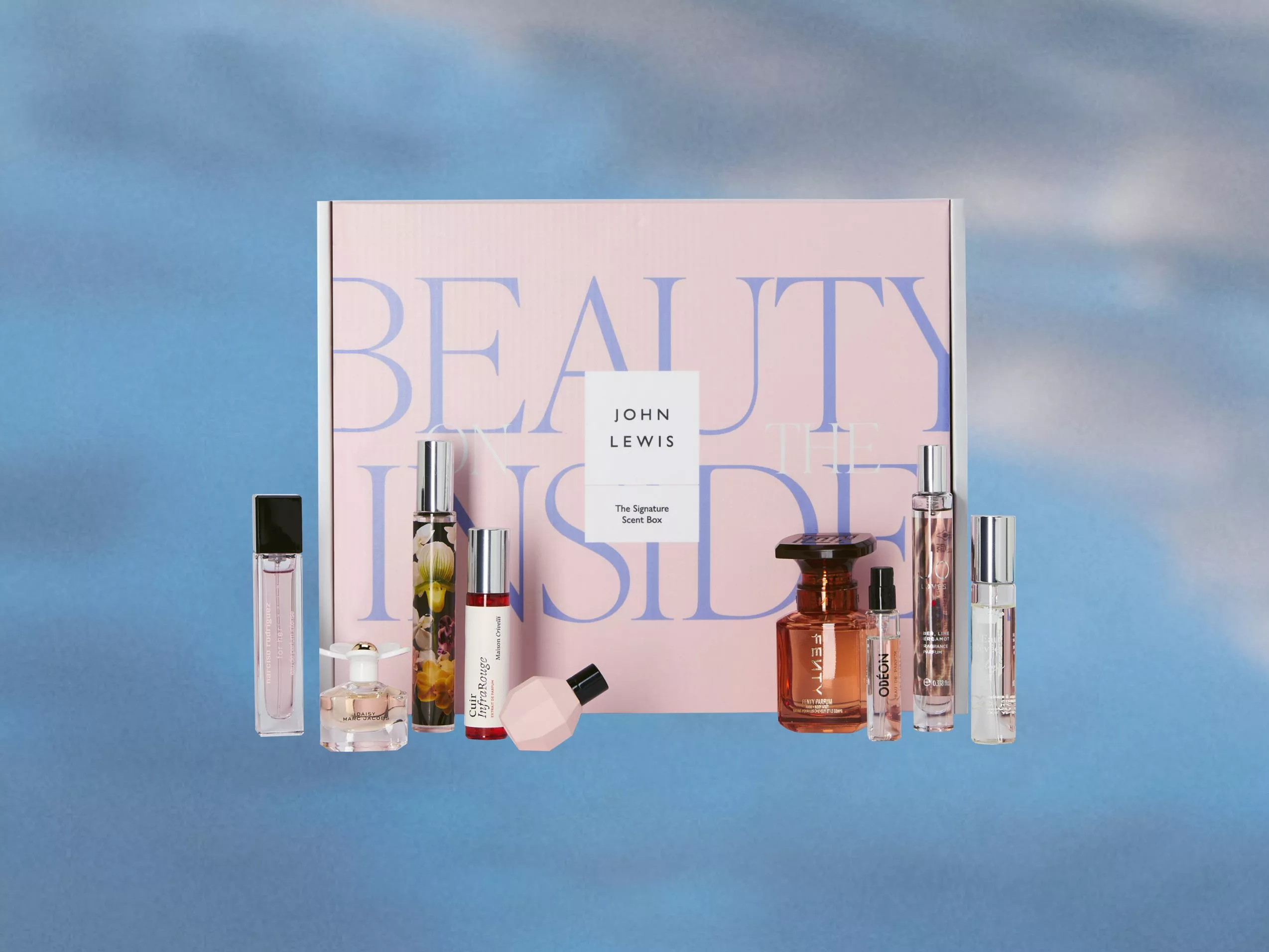 A pink box with "Beauty on the Inside" text, featuring a blue background. It's a John Lewis Signature Scent Box.