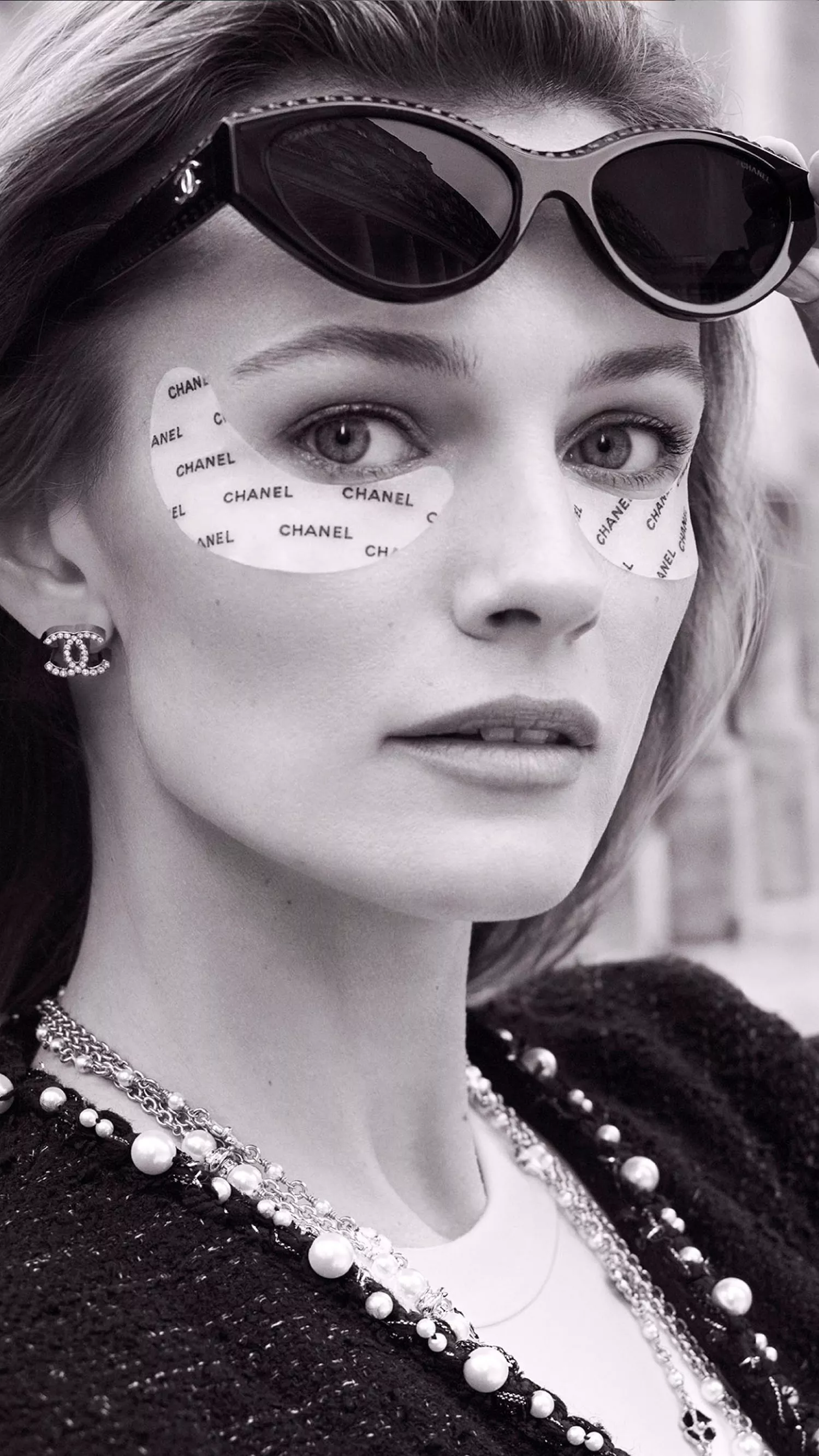 Model wearing Chanel beauty eye patches 
