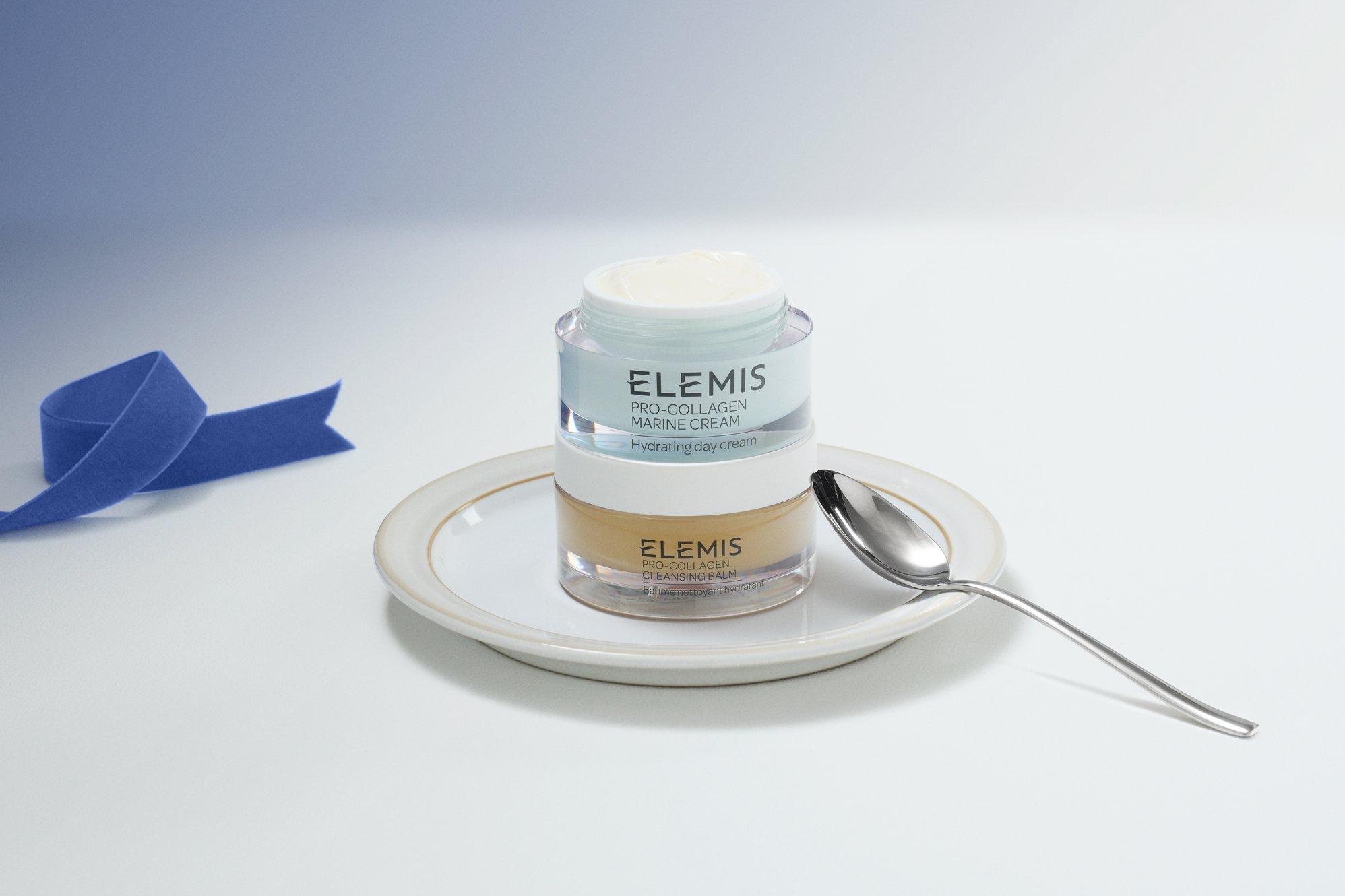 Image of elemis products stacked up on top of each other on a blue background