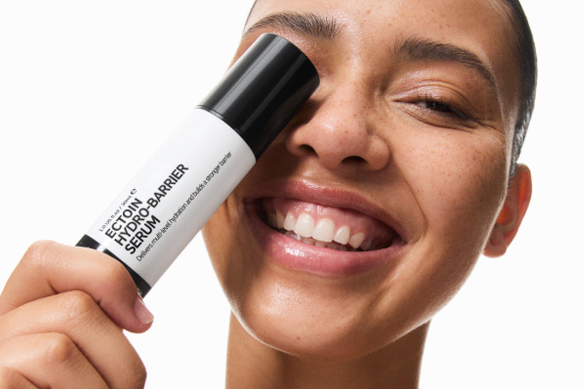 Image of a model holding up a INKEY List Ectoin Serum