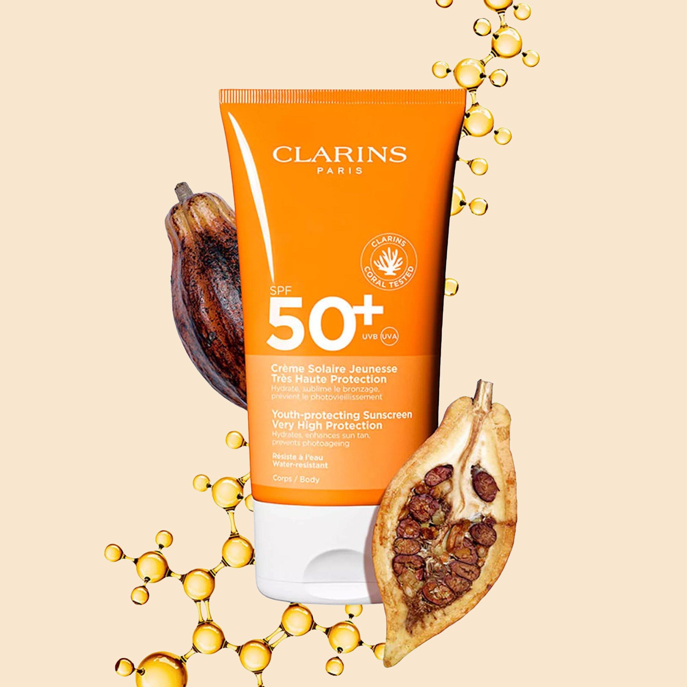 clarins SPF product with coca fruit cut in half