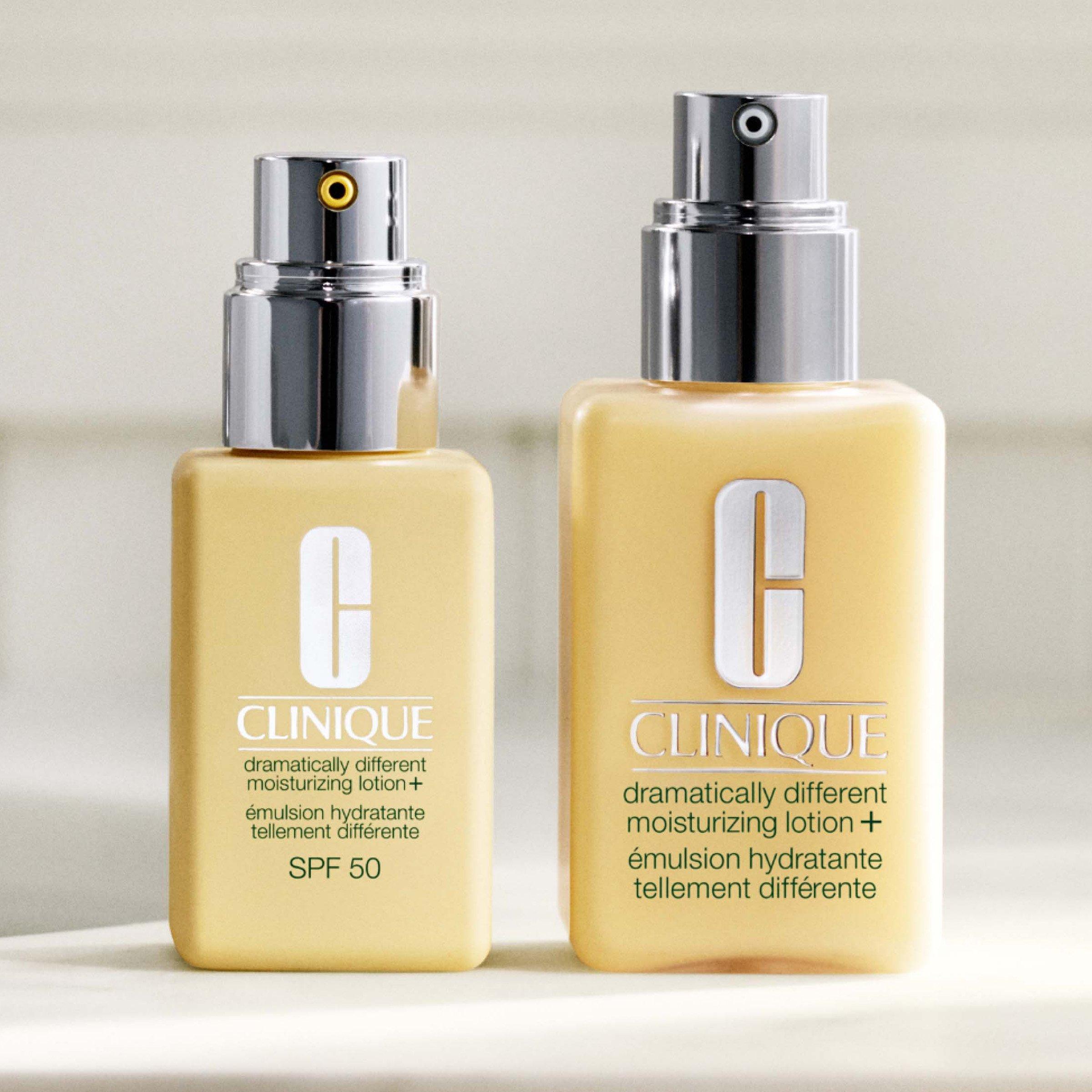 Two bottles of Clinique moisturizer with yellow bottles and silver spray tops, side by side.